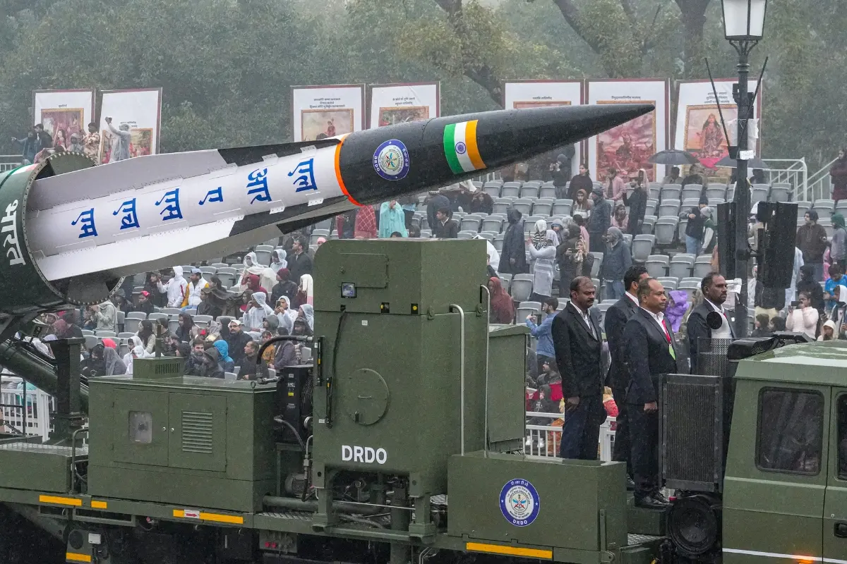 A defence tableau featuring DRDO's Long Range Anti-Ship Missile (LRAShM) rolls past during the rain-affected full-dress rehearsal for the Republic Day Parade, in New Delhi.| Photo: PTI