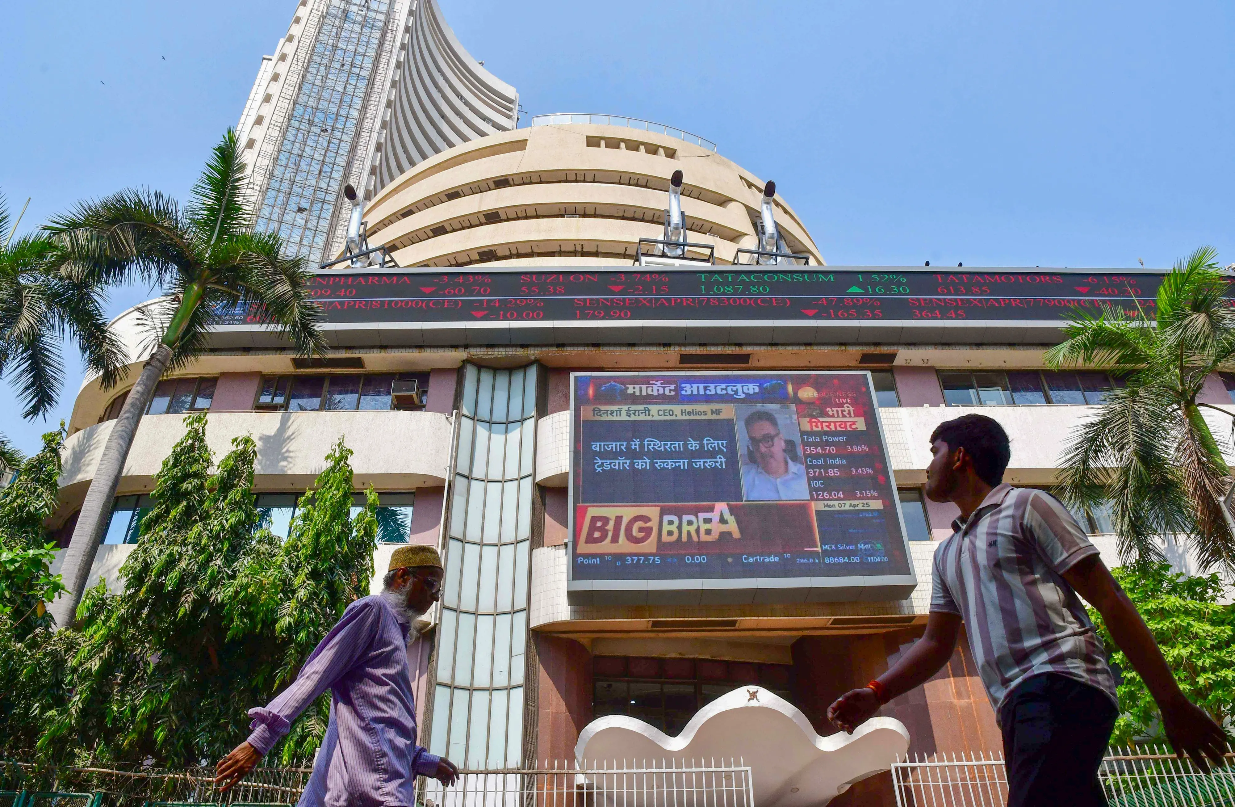 People walk past the Bombay Stock Exchange (BSE) building in Mumbai | File photo: PTI