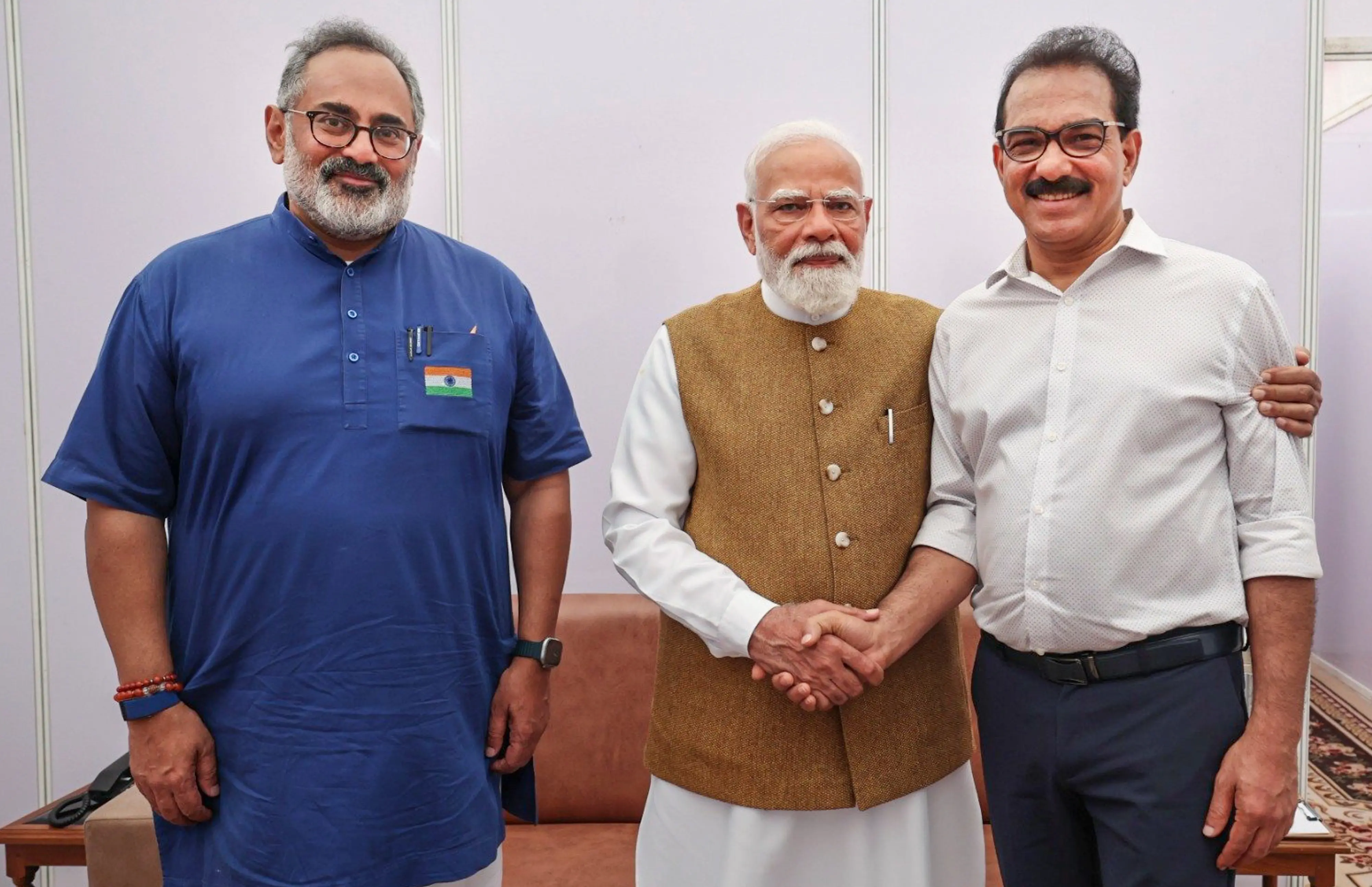 Prime Minister Narendra Modi, centre, meets Twenty20 party Founder Sabu M Jacob, right in Thiruvananthapuram, Kerala