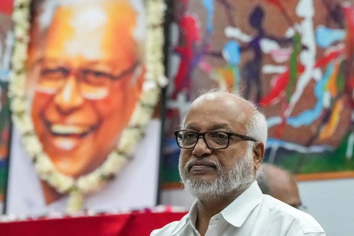 M A Baby with V S Achuthanandan's portrait in the background | File Photo: PTI