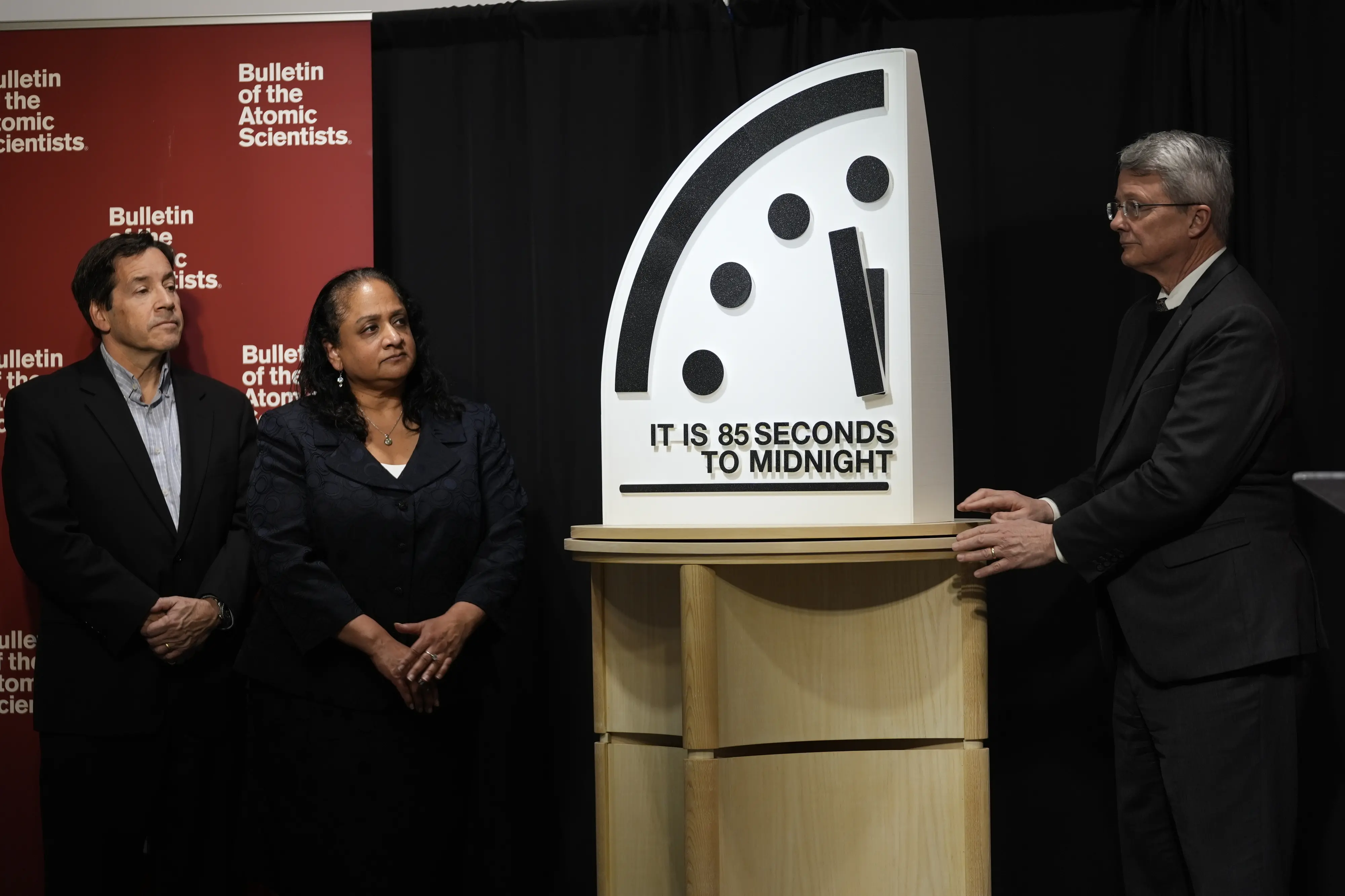 The Bulletin of the Atomic Scientists members, from left, Jon B. Wolfsthal, Asha M. George and Steve Fetter reveal the Doomsday Clock, set to 85 seconds to midnight | AP