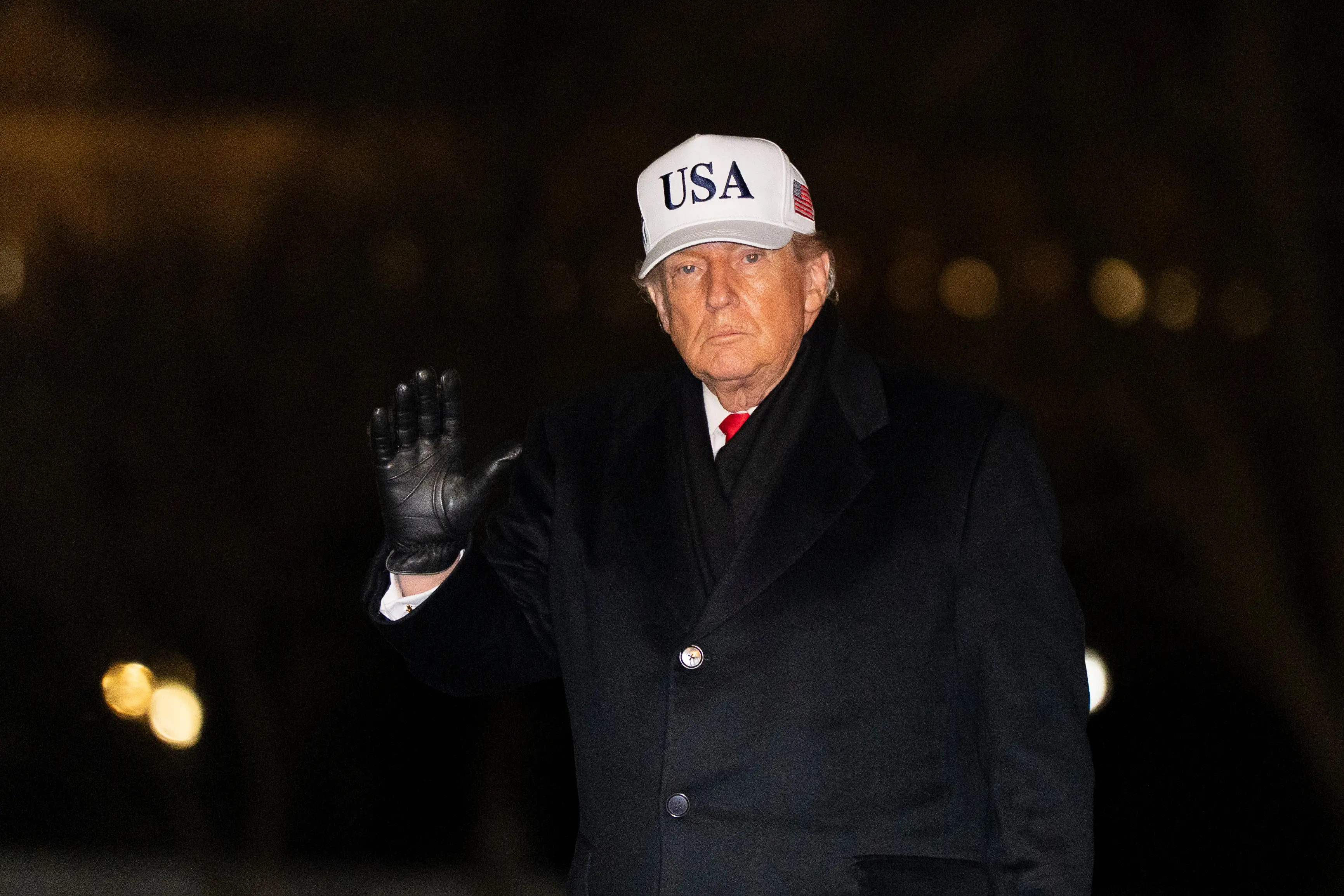 President Donald Trump waves as he walks from Marine One after arriving on the South Lawn of the White House | Photo: AP