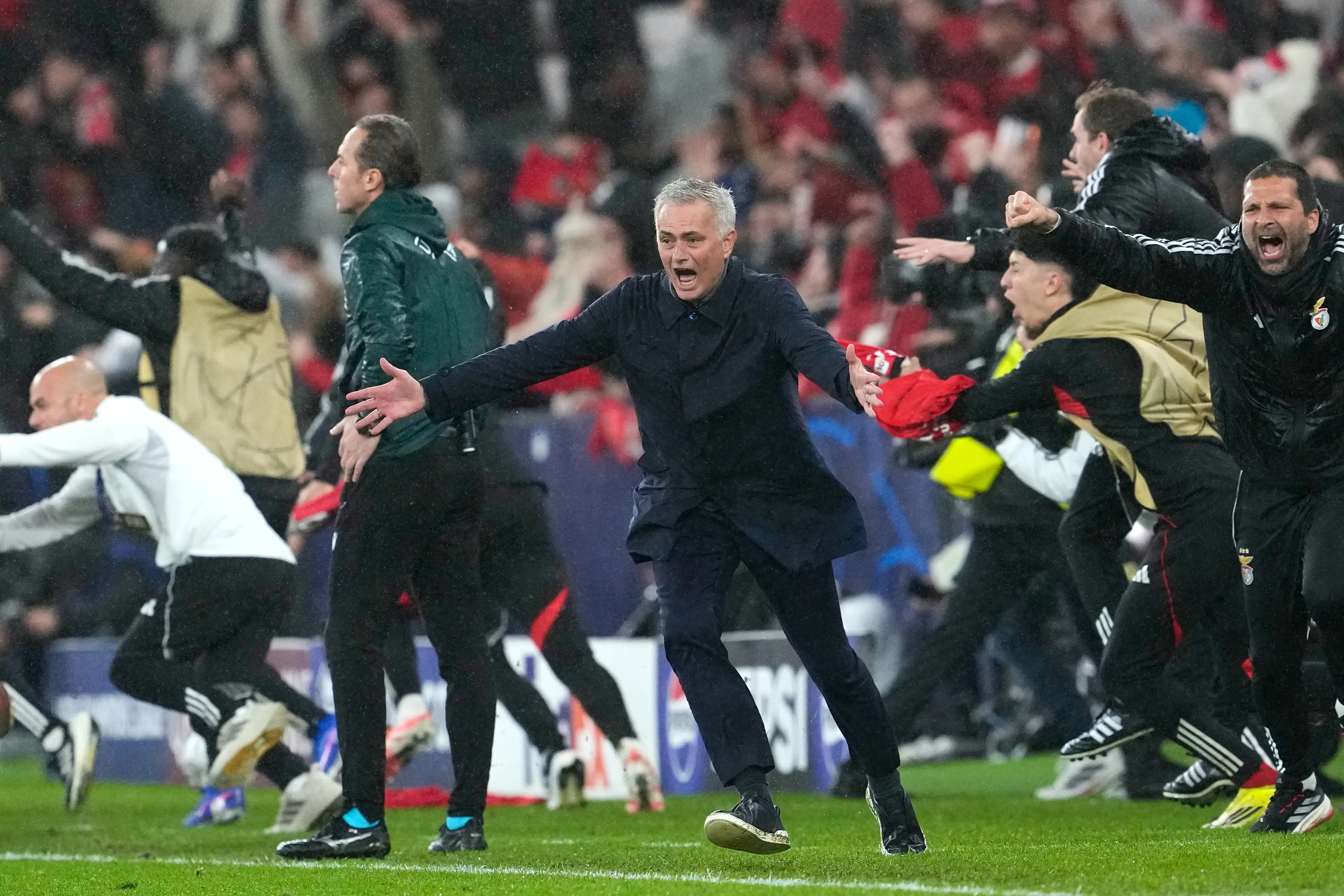 Benfica's head coach Jose Mourinho runs celebrating at the end of a Champions League opening phase soccer match between Benfica and Real Madrid | AP