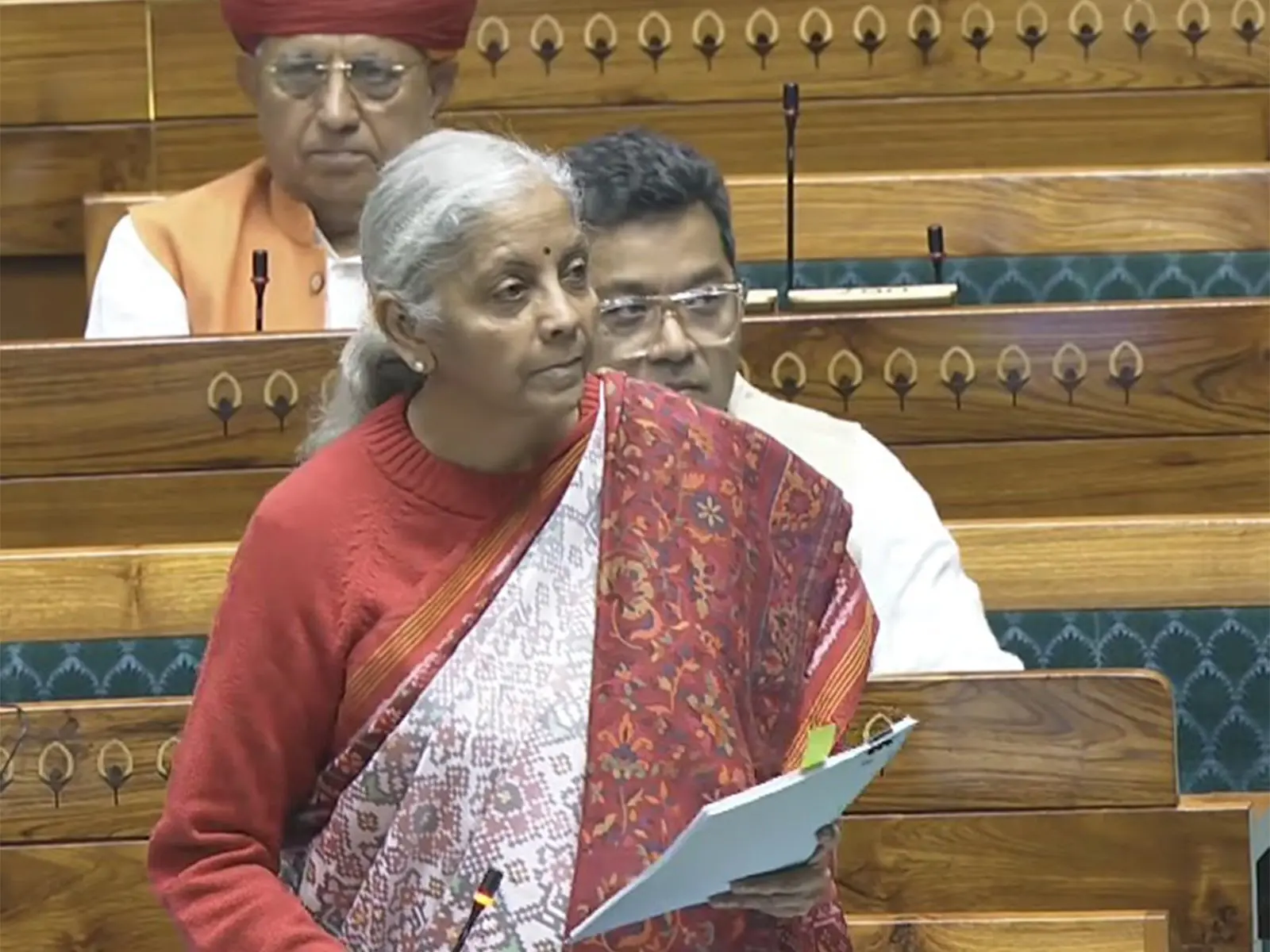 Finance Minister Nirmala Sitharaman speaks in the Lok Sabha during the Winter Session of Parliament, as she introduces the Insurance Laws (Amendment) Bill, 2025 and defends supplementary demands for grants. Photo: ANI Screengrab