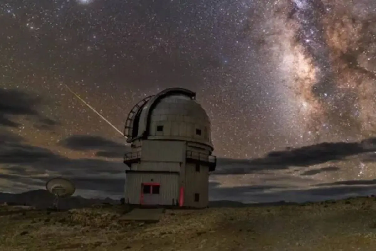 A rare red auroral glow streaks across the night sky above the Hanle Dark Sky Reserve in eastern Ladakh, as intense solar activity illuminates one of India's clearest high-altitude skies.