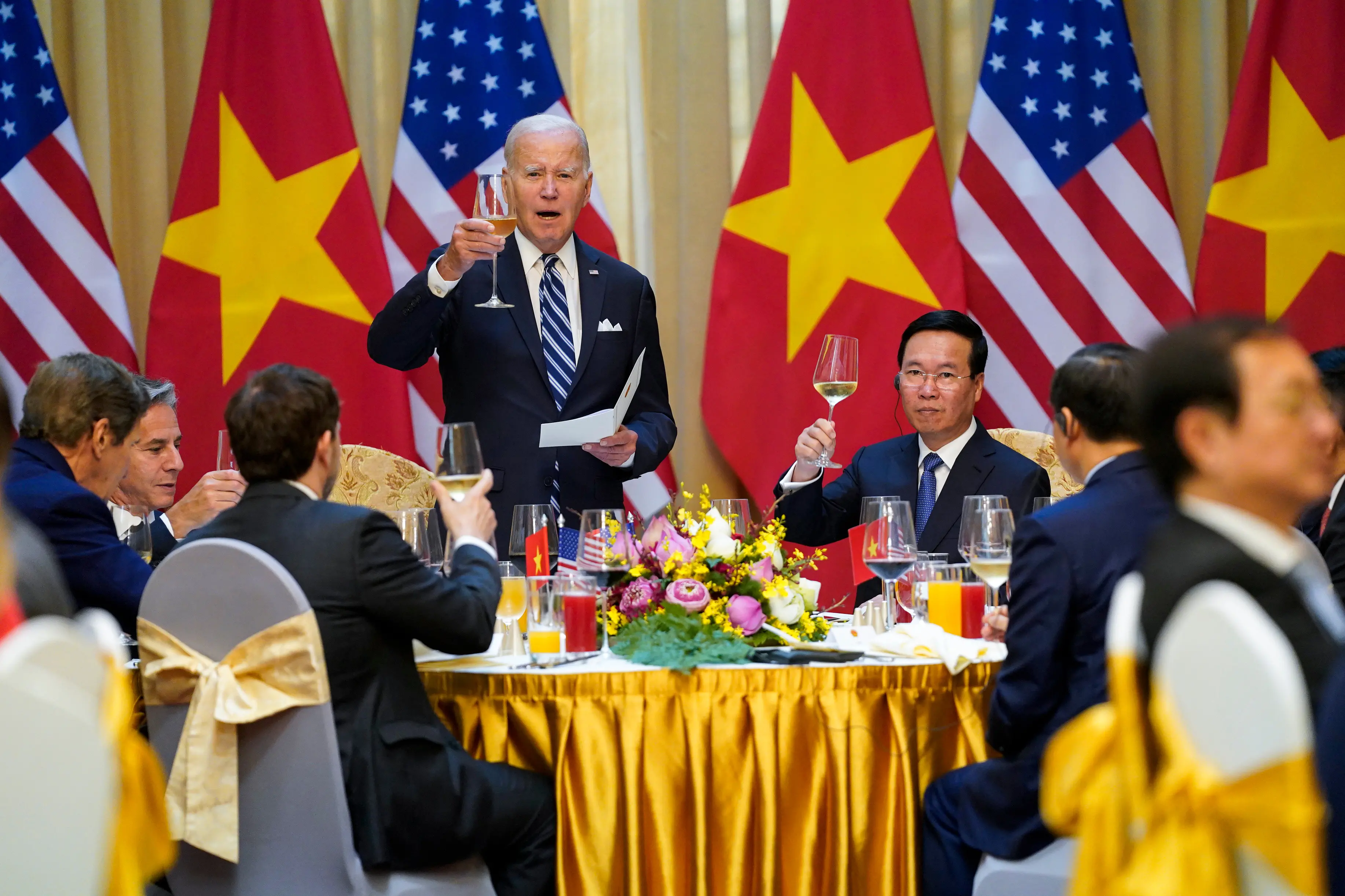 Former US President Joe Biden raises a toast as he participates in a State Luncheon with then Vietnam President Vo Van Thuong in Hanoi | File photo: AP