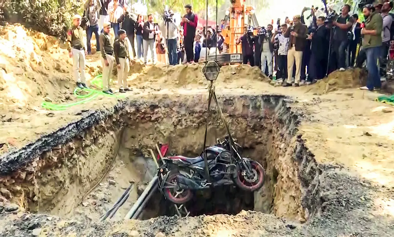 A visual of late Kamal Dhyani's bike being recovered from the pit in Janakpuri, New Delhi, on Friday. (ANI Video Grab)
