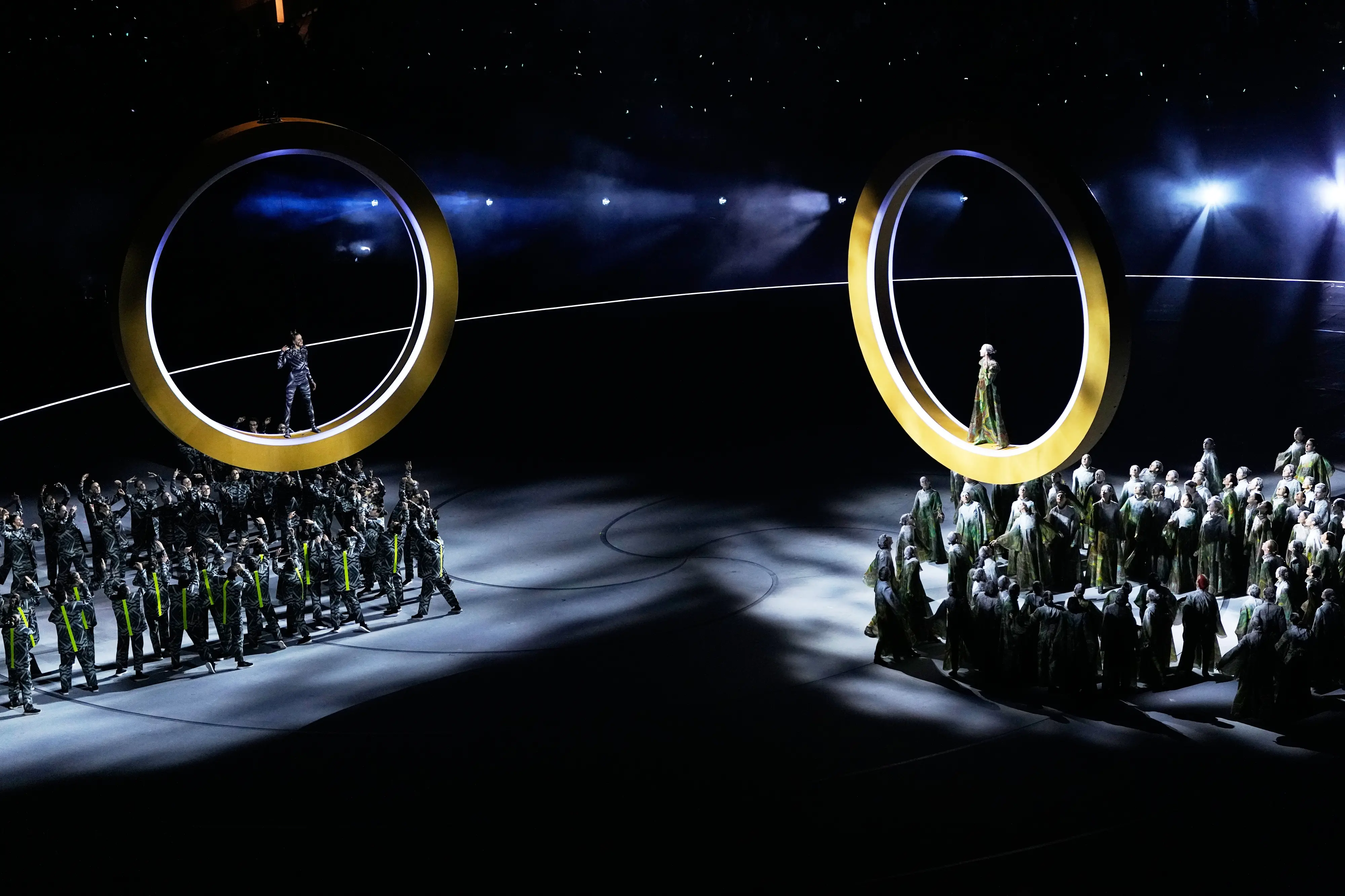 Artists perform during the Olympic opening ceremony at the 2026 Winter Olympics in Milan (AP Photo/Petr David Josek)