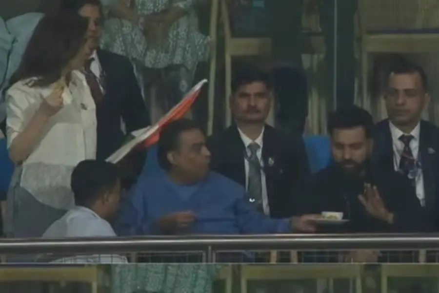 Mukesh Ambani offering a cup of tea to Rohit Sharma in the VIP stands at Wankhede Stadium during the T20 World Cup match.