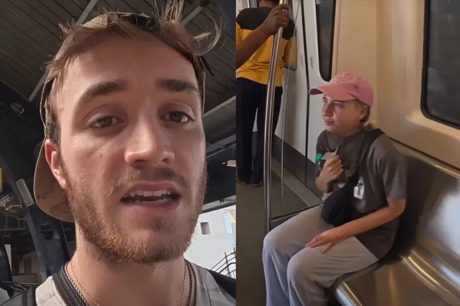 British vlogger Rory Porter filming himself inside a modern Delhi Metro coach, comparing its facilities to the London Underground.