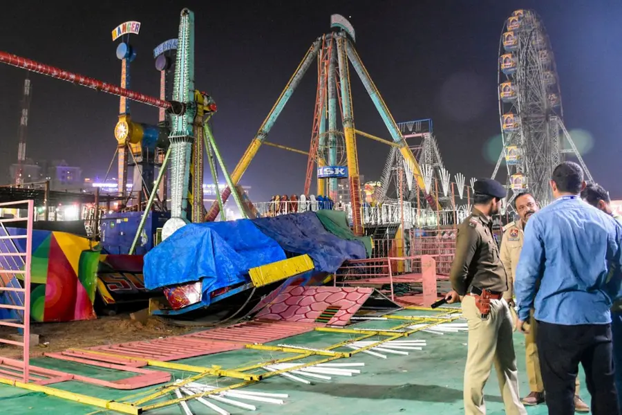 Police personnel at the spot after a swing fell down at Surajkund fair, in Faridabad,
