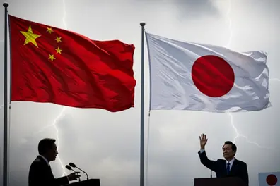 China vows 'resolute response' to any reckless acts after Japan election
