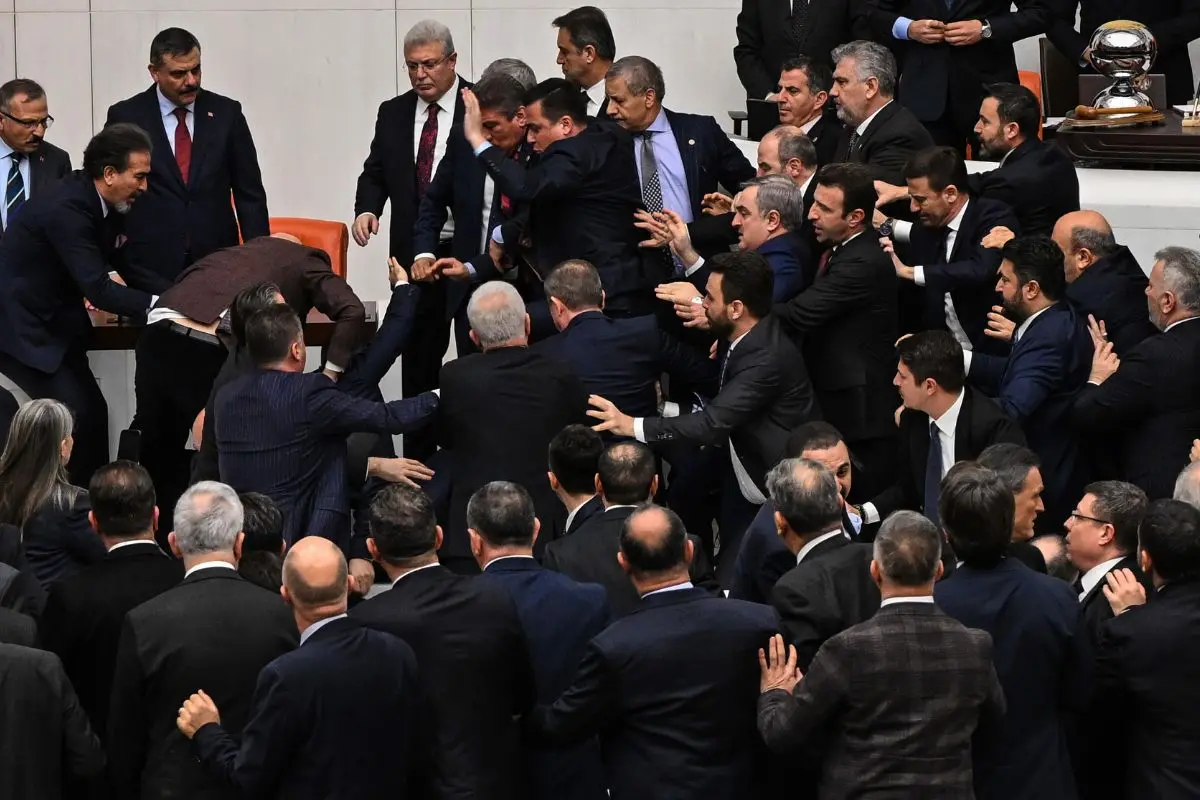 Turkey's ruling party and opposition lawmakers clash over the appointment of Istanbul Chief Prosecutor Akin Gurlek as justice minister at the parliament in Ankara, Turkey, Wednesday, Feb. 11, 2026. (Ugur Yildirim/DIA Photo via AP)