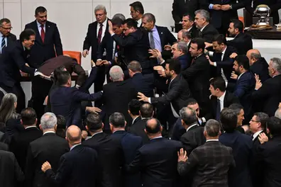 Turkish Parliament explodes into chaos as lawmakers trade punches in justice minister showdown