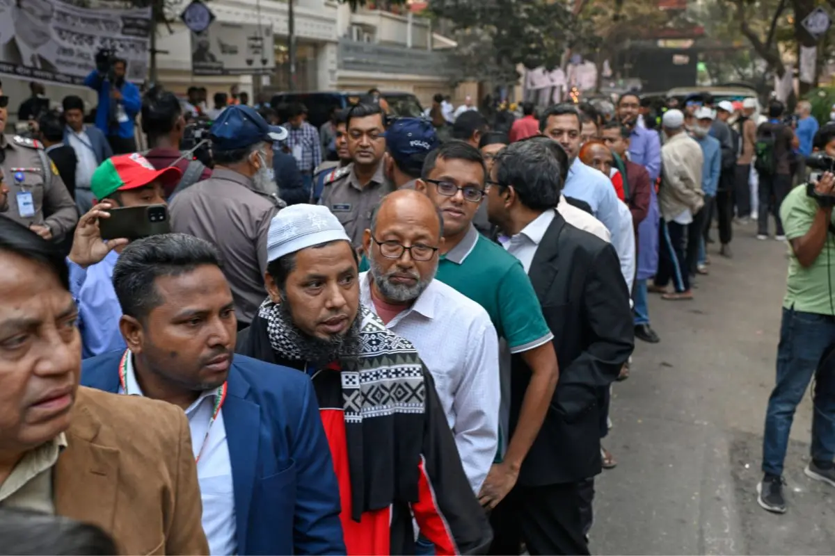 Voters wait in line outside a polling center ahead of its opening to cast their ballots during the national parliamentary elections in Dhaka, Bangladesh, Thursday, Feb. 12, 2026. (AP Photo/Mahmud Hossain Opu)