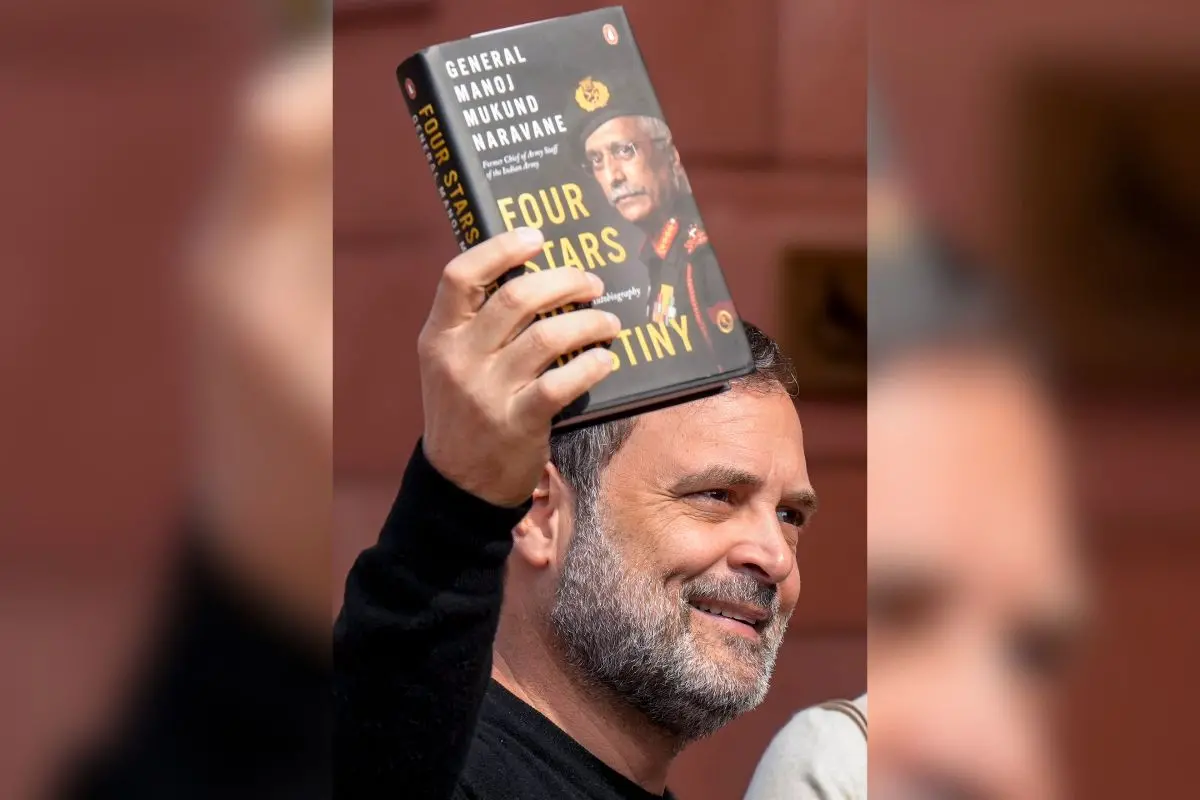 Leader of Opposition in the Lok Sabha, Rahul Gandhi, shows a copy of the unpublished 'memoir' of former Army chief M M Naravane during the Budget Session of Parliament. (PTI Photo/Shahbaz Khan)