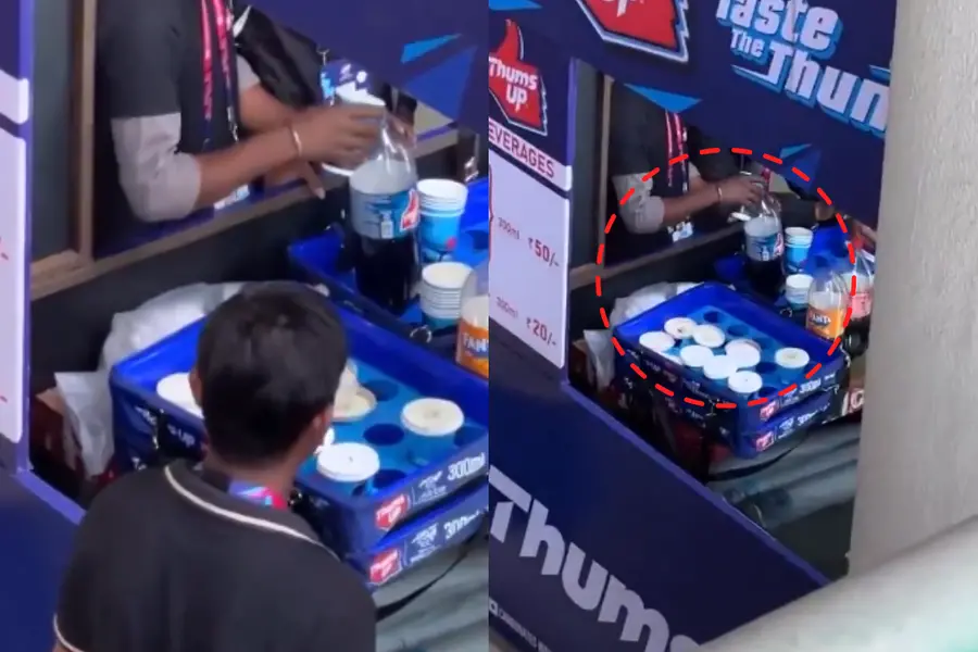 A screengrab from the viral video showing a worker pouring drinks into the bottle