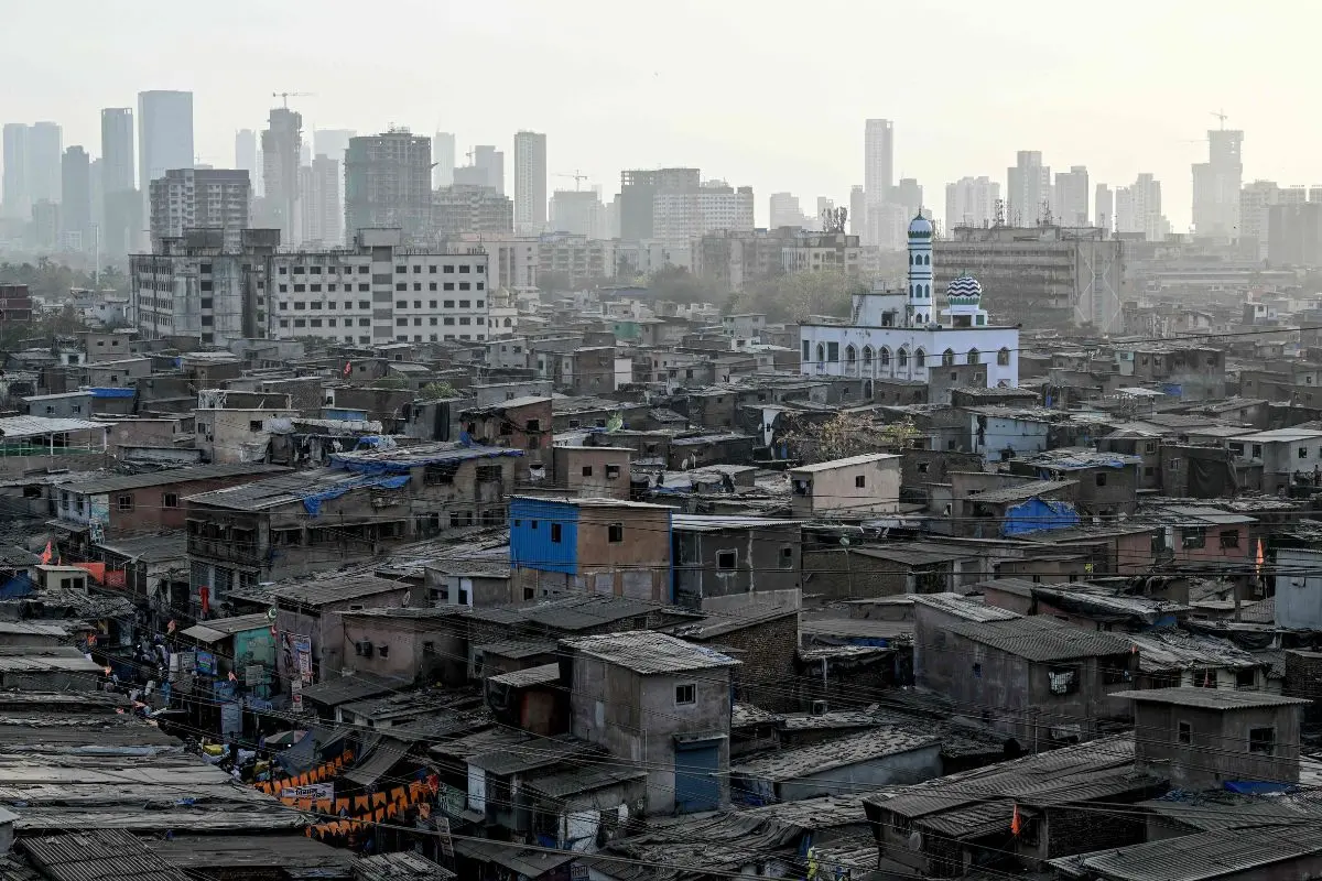 A general view of the Dharavi slums with high rise buildings seen in the background in Mumbai (File photo: AFP)