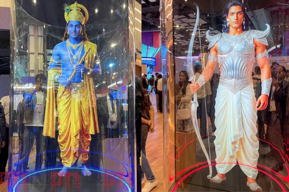 An AI-generated image of 'Arjuna', a warrior from the epic 'Mahabharat', is displayed thorough holographic projection inside a transparent cylindrical capsule at the 'Jio Intelligence' pavilion of Reliance Industries, during the AI Impact Summit, in New Delhi, Friday, Feb. 20, 2026 (Photo: PTI)
