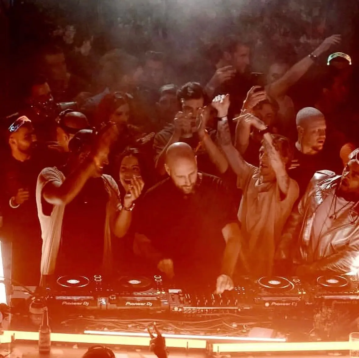Solee (C) commands the stage with his signature melodic techno and progressive house sound during a live festival performance.