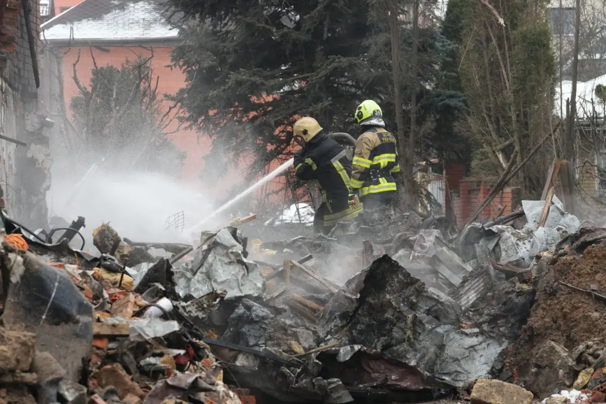 Emergency services personnel work to extinguish a fire following a Russian attack in Kyiv, Ukraine, Sunday, Feb. 22, 2026 (Photo: AP/PTI)