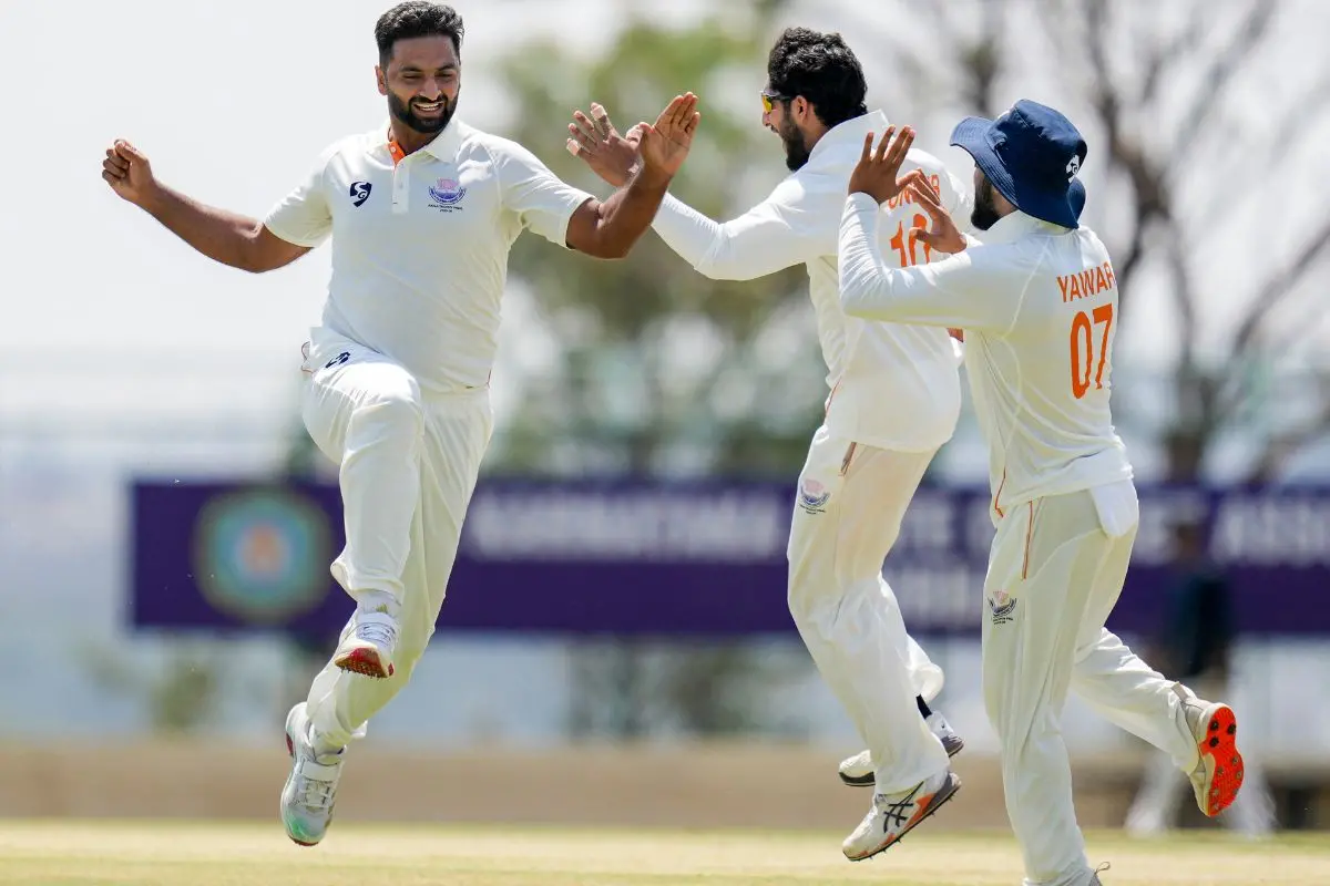 Jammu and Kashmir's Auqib Nabi celebrates with teammates after taking the wicket of Karnataka's Smaran Ravichandran during the third day of the Ranji Trophy 2025-26 final cricket match between Karnataka and Jammu and Kashmir at the KSCA Cricket Stadium in Hubballi, Karnataka. | Photo: PTI