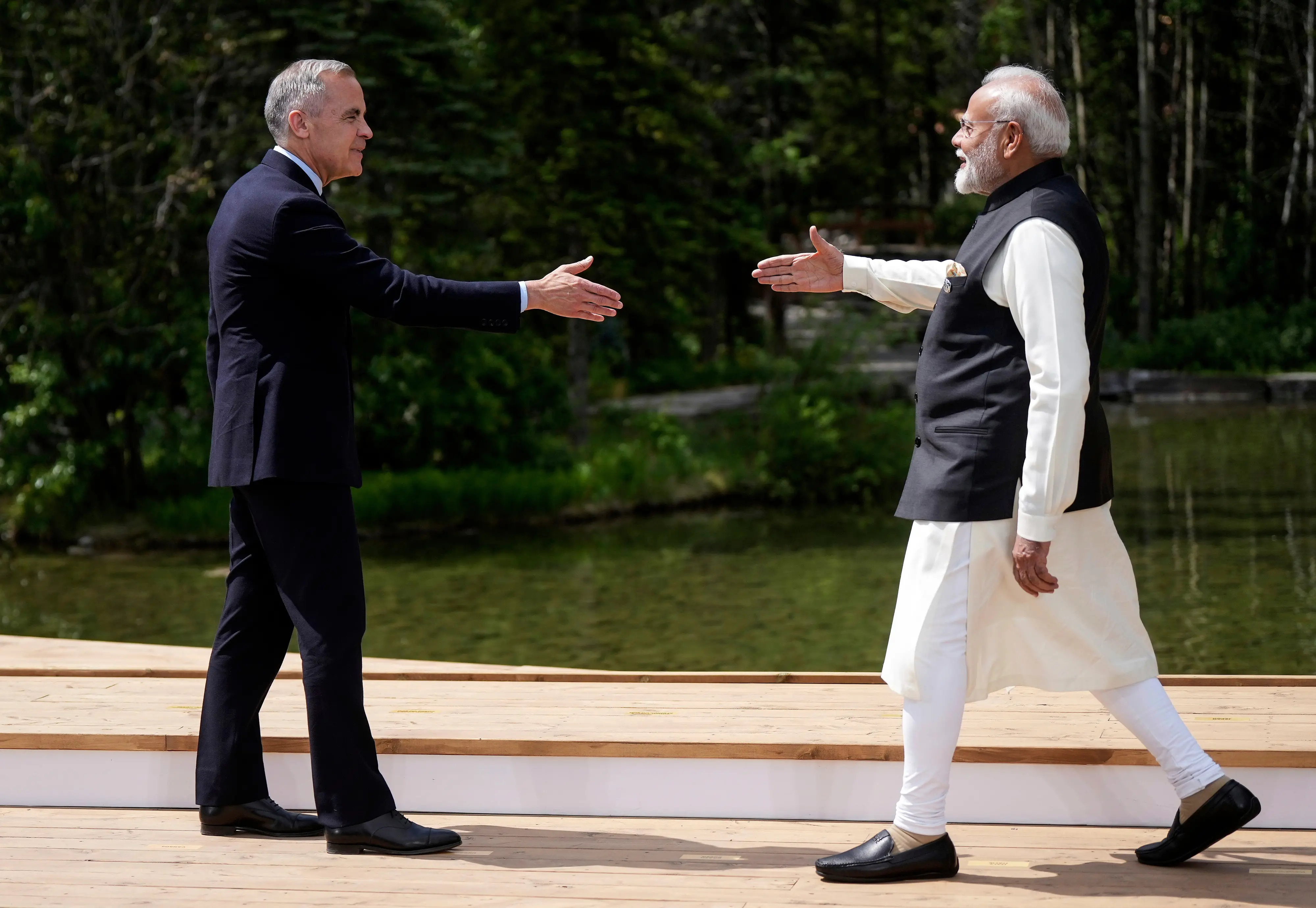 Canada's Prime Minister Mark Carney, left, and India's Prime Minister Narendra Modi | File photo: AP