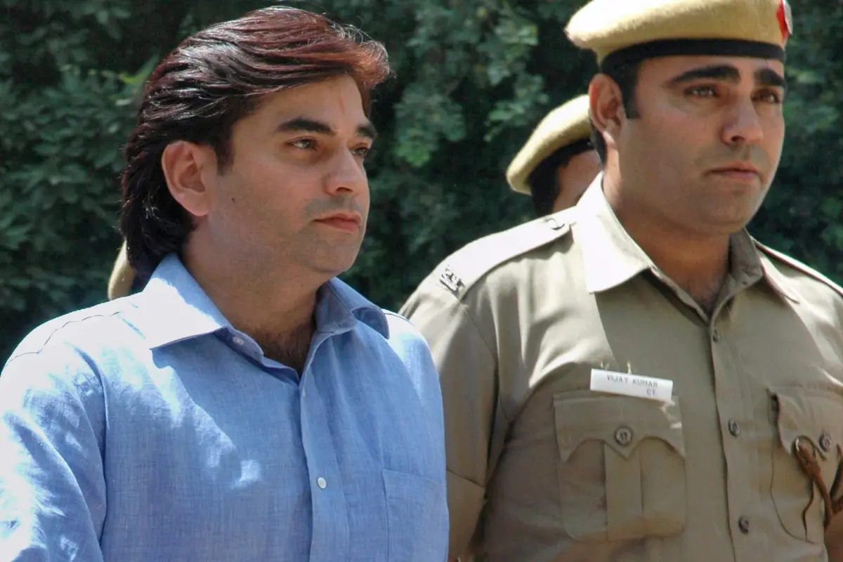File: Vikas Yadav, the son of a wealthy Indian politician, is escorted by policemen to be produced in court in New Delhi | Photo: AP