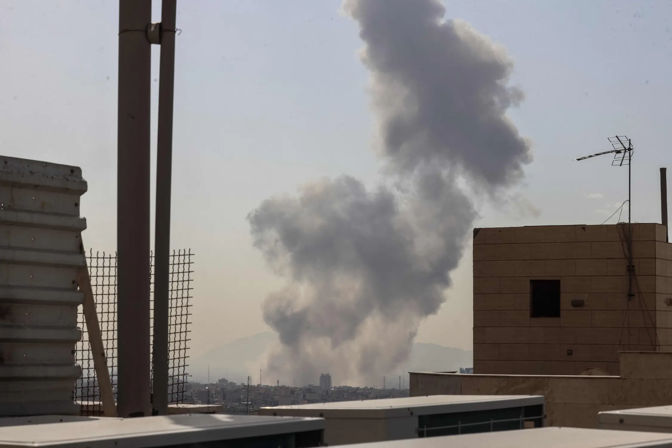 A plume of smoke rises following a reported explosion in Tehran | Photo: AFP