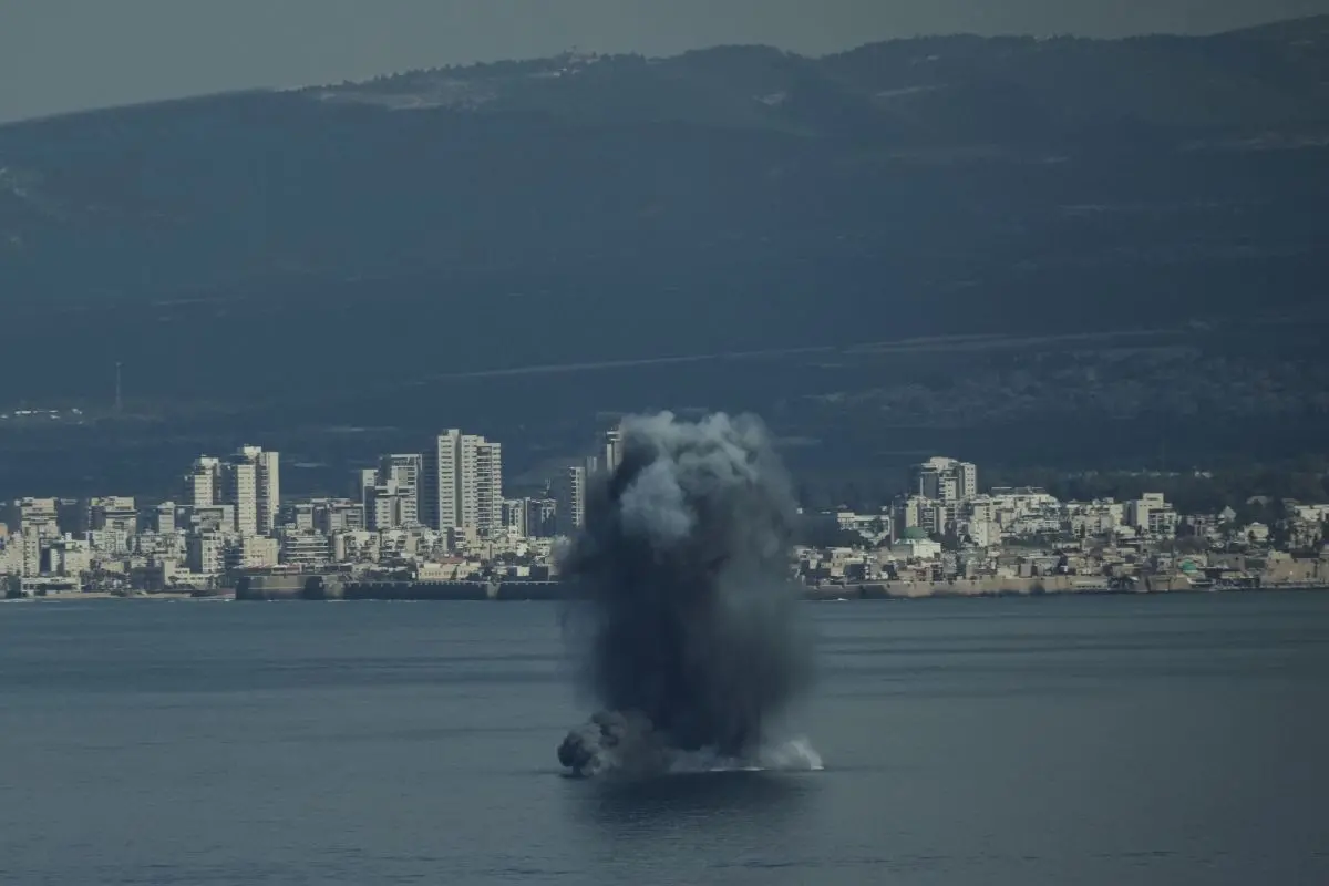 An incoming projectile explodes over the water as Israel issues a nationwide alert following its strikes on Iran, in Haifa Bay, northern Israel, Saturday, Feb. 28, 2026 (Photo: AP)"