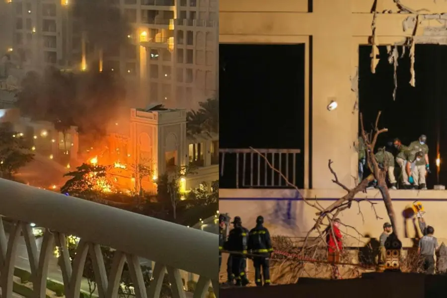 Firemen and rescue workers inspect the site of an explosion at the Fairmont The Palm Hotel in Dubai