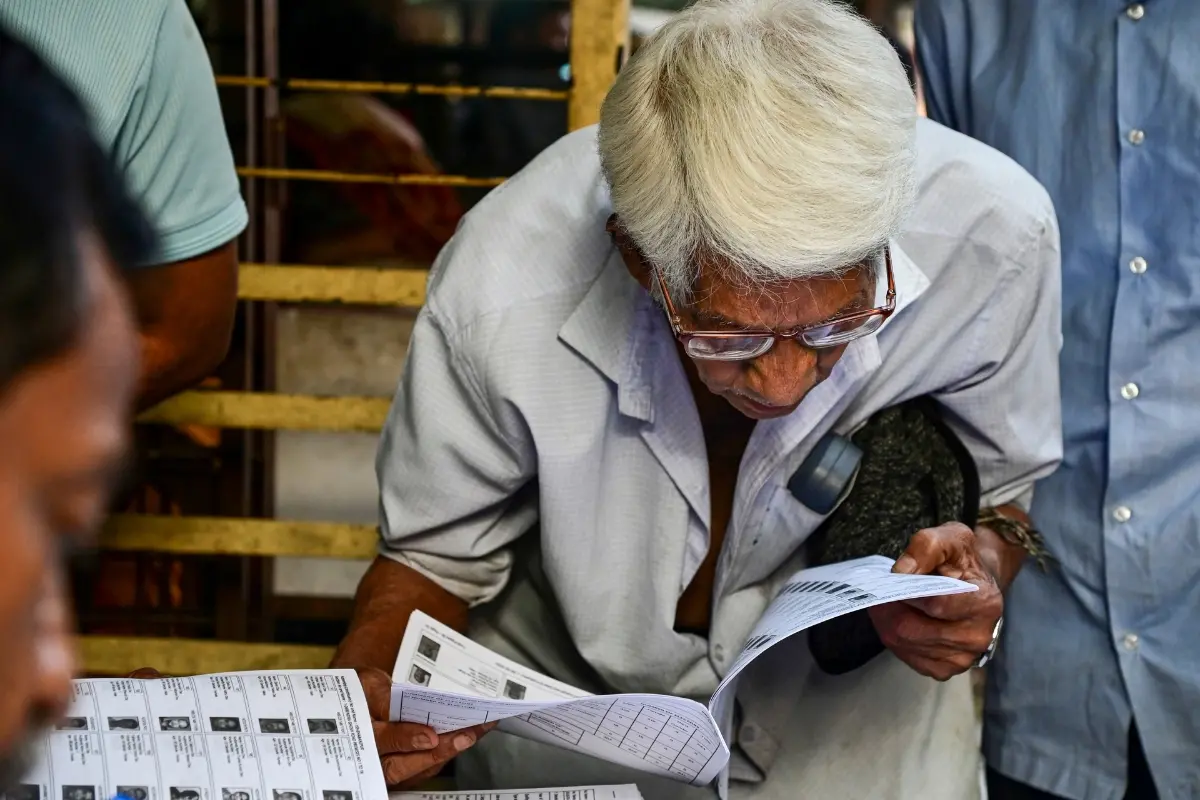 A voter checks his name in the list after the Election Commission published West Bengal's post-SIR electoral rolls | Photo: PTI