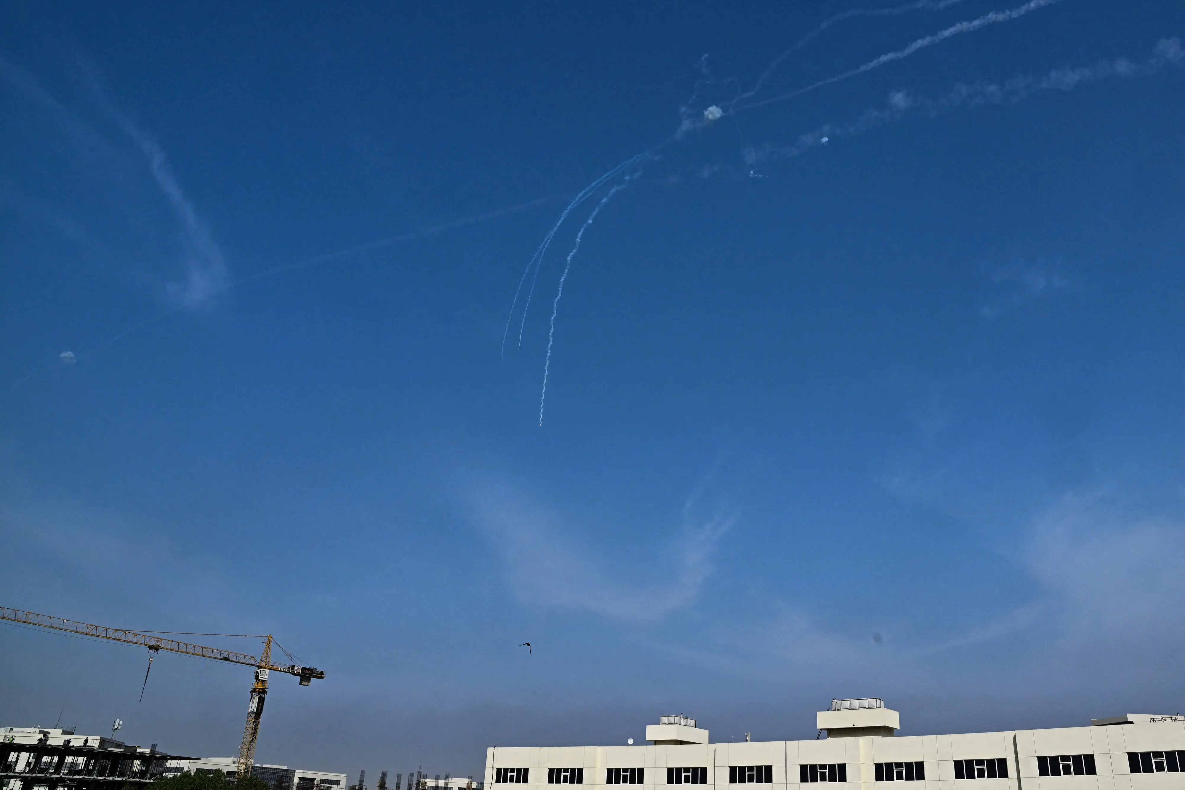 Explosions from the interception of an Iranian projectile are seen in the sky over Dubai | Photo: AFP