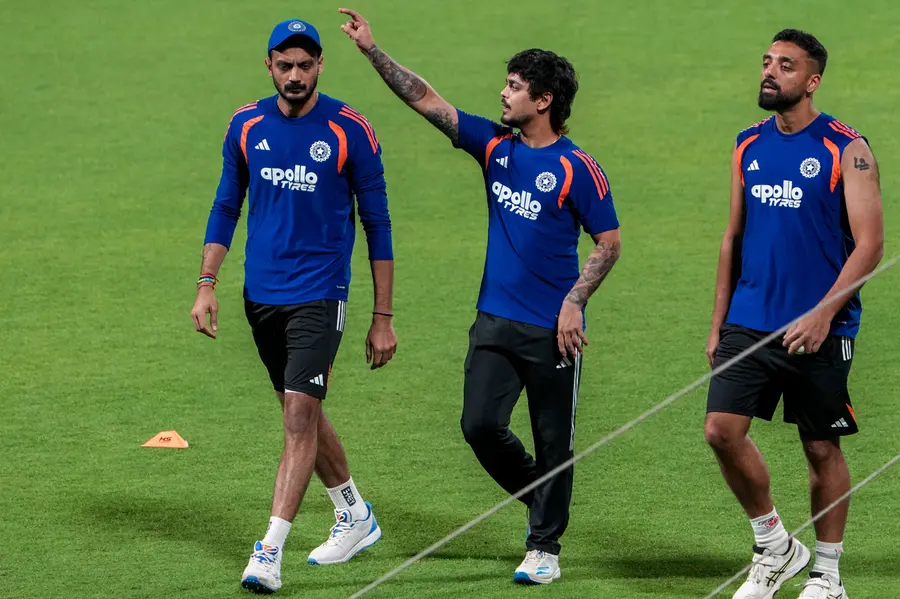 From left, India's Axar Patel, Ishan Kishan and Varun Chakravarthy during a practice session