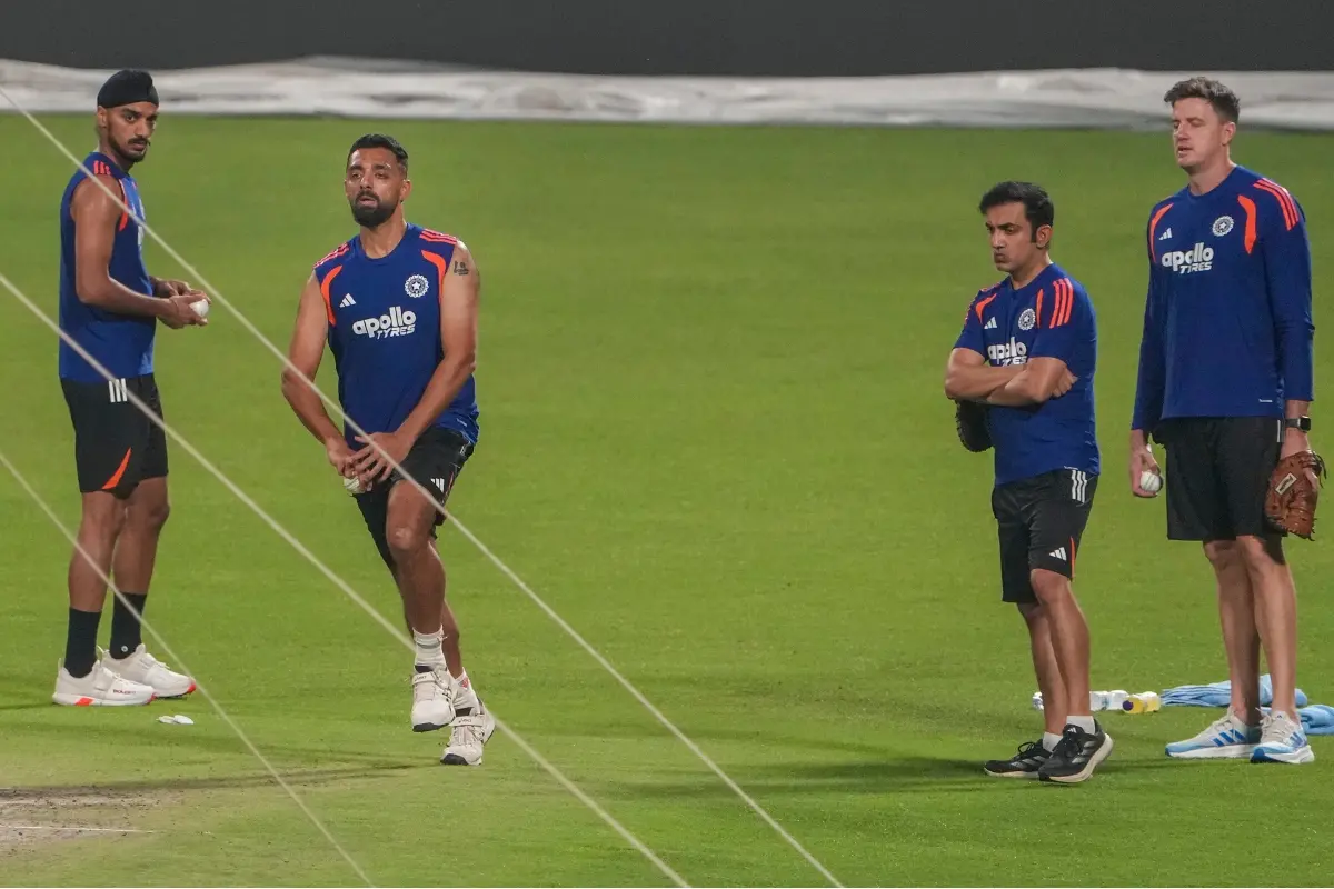 From left, India's Arshdeep Singh, Varun Chakravarthy, head coach Gautam Gambhir and bowling coach Morne Morkel during a practice session ahead of an ICC Men's T20 World Cup 2026 cricket match between India and West Indies | Photo: PTI
