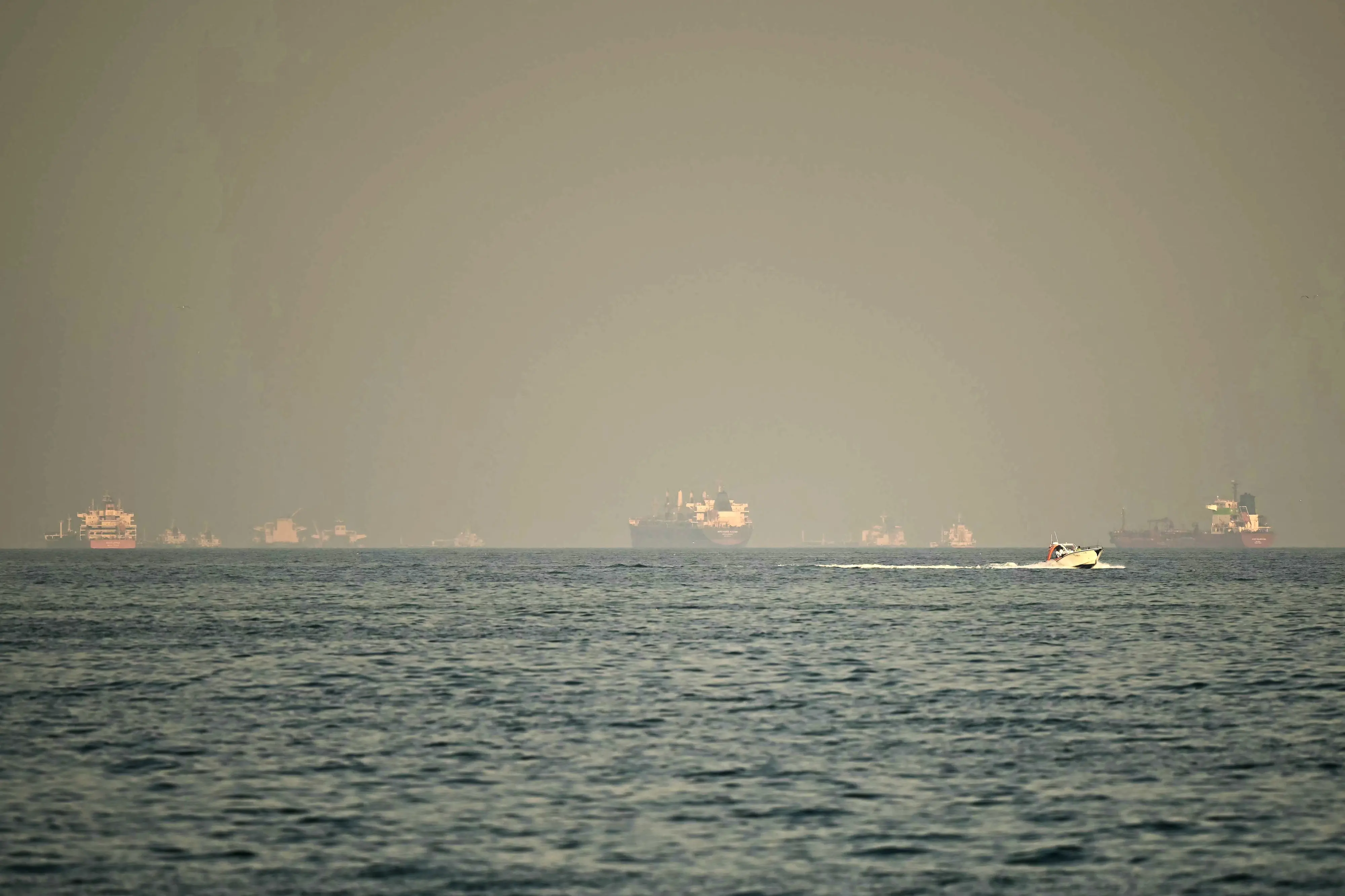 Cargo ships and tankers are seen off coast city of Fujairah, in the Strait of Hormuz in the northern Emirate | AFP