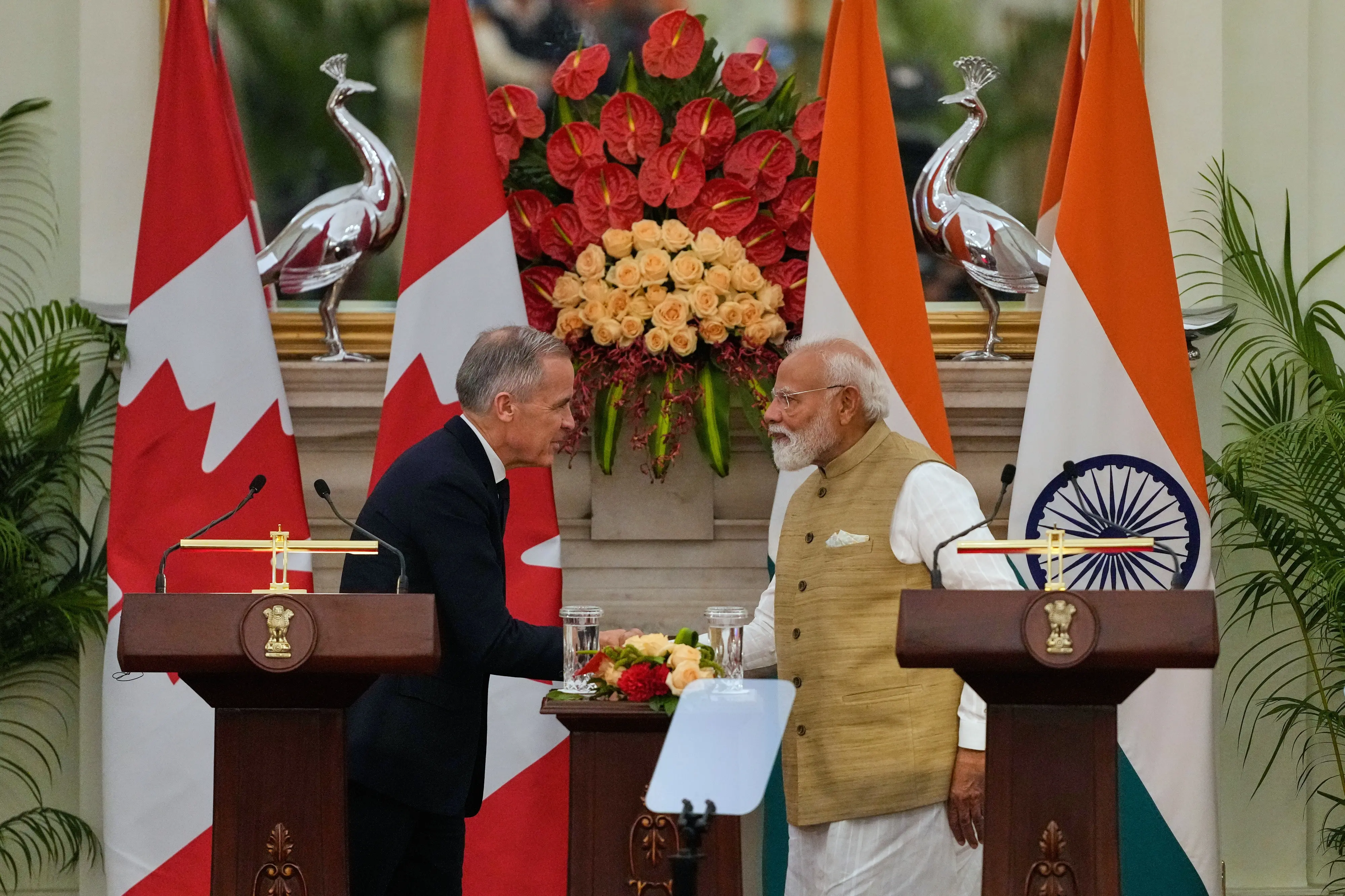 India Prime Minister Narendra Modi, right, shakes hand with his Canadian counterpart Mark Carney after signing of various memorandum of understanding between the two nations | Photo: AP