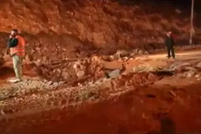 Jerusalem missile strike: Crews fill blast crater after Iranian missile barrage wounds seven