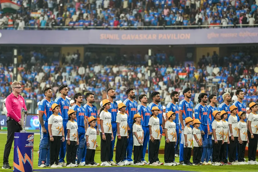 India's players stand for the national anthem before the start of the ICC Men's T20 World Cup 2026 cricket match between India and USA, at the Wankhede Stadium