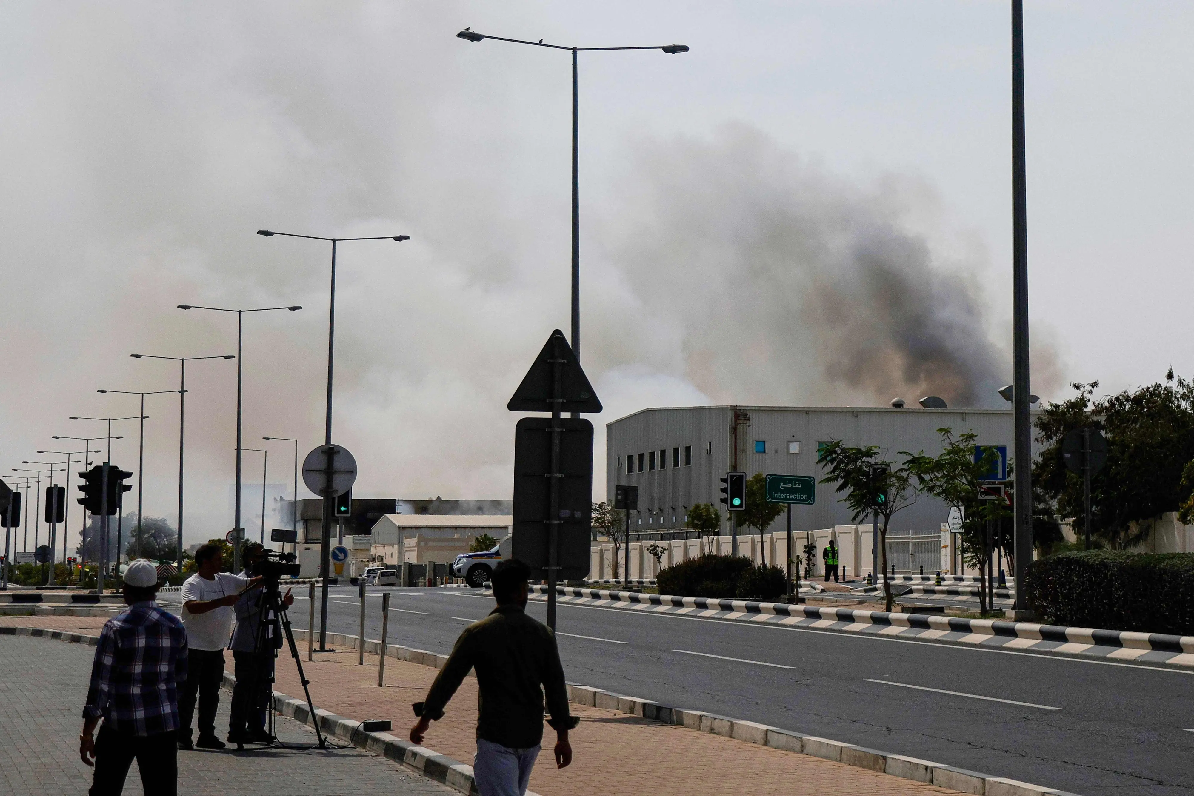 A plume of smoke rising from a reported Iranian strike in the industrial district of Doha on March 1 | AFP