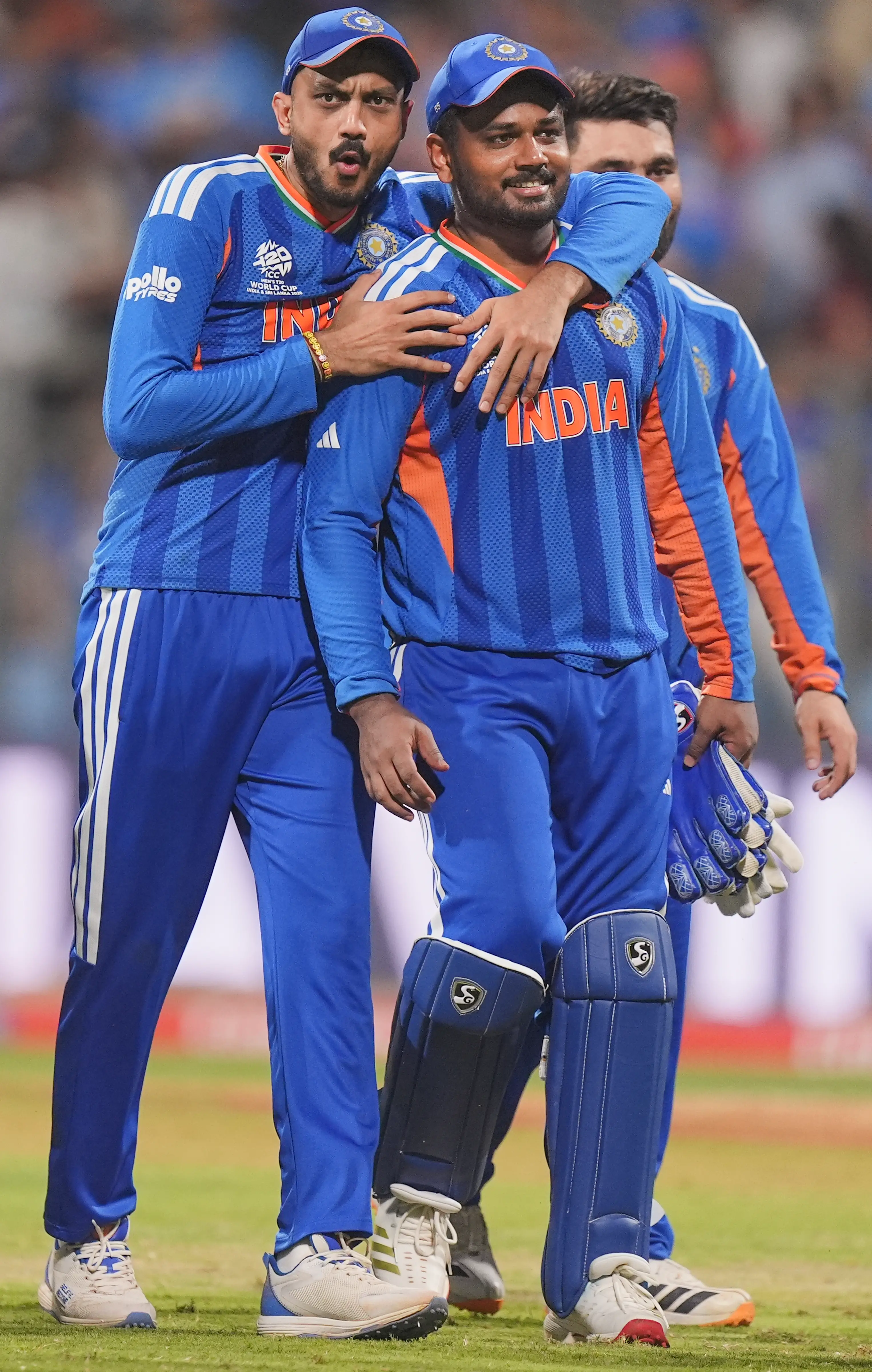 India's Axar Patel, left, and Sanju Samson celebrate after winning the ICC Men's T20 World Cup 2026 second semifinal cricket match between India and England at Wankhede Stadium | Photo: PTI