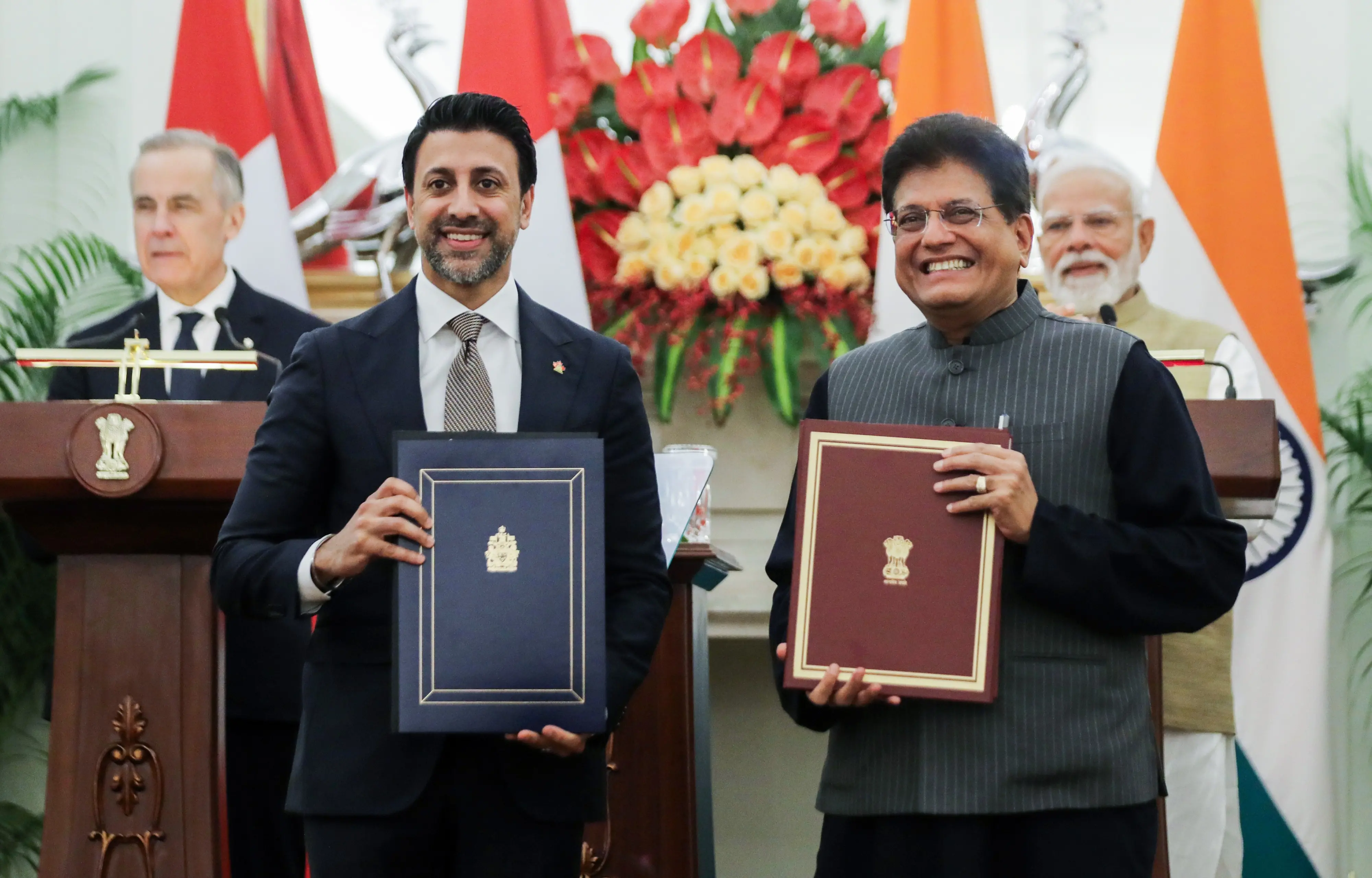 Prime Minister Narendra Modi and Prime Minister of Canada Mark Carney witness as Union Minister of Commerce and Industry Piyush Goyal and Canada's Minister of International Trade Maninder Sidhu exchange MoU | Photo: ANI