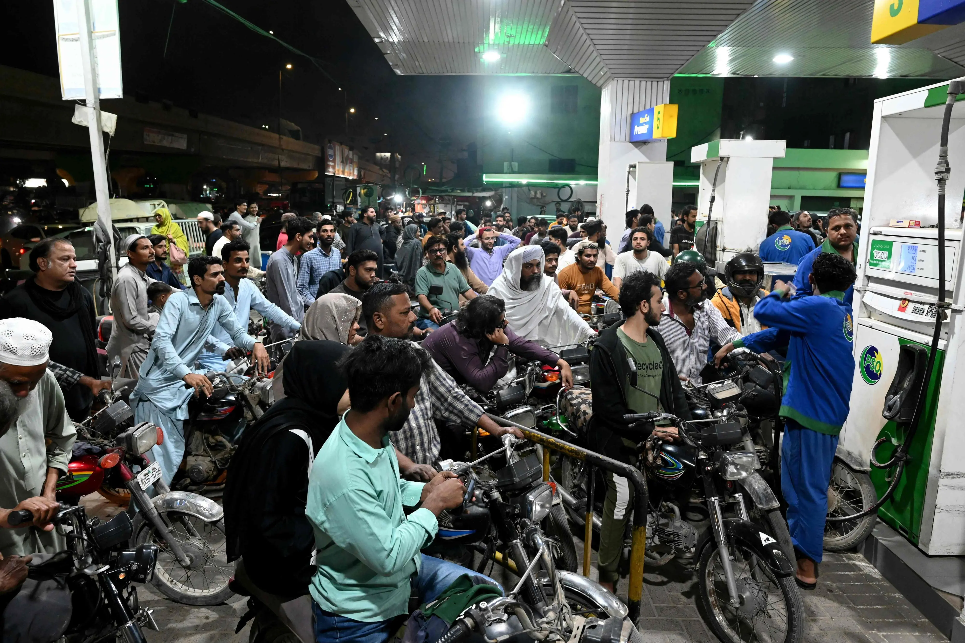 Clients queue at a gas station amid spikes in petrol prices in Karachi on March 7, 2026. (Photo by Rizwan TABASSUM / AFP)