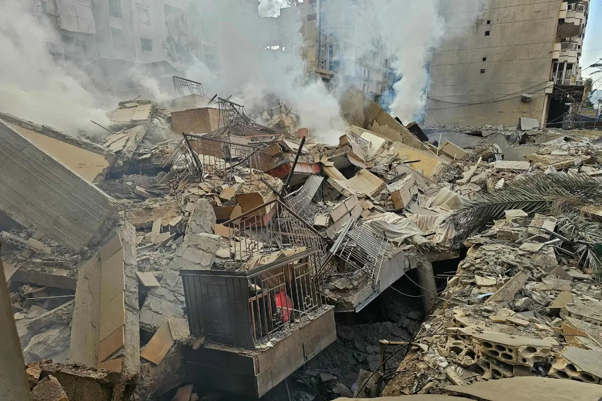 Smoke rises from the rubble of destroyed buildings at the site of an Israeli airstrike that targeted Haret Hreik neighbourhood in Beirut's southern suburbs | Photo: AFP