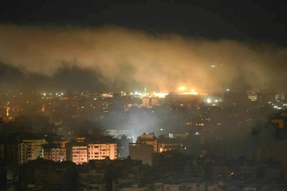 Smoke rises after an Israeli airstrike targeted an area in Beirut's southern suburbs | AFP
