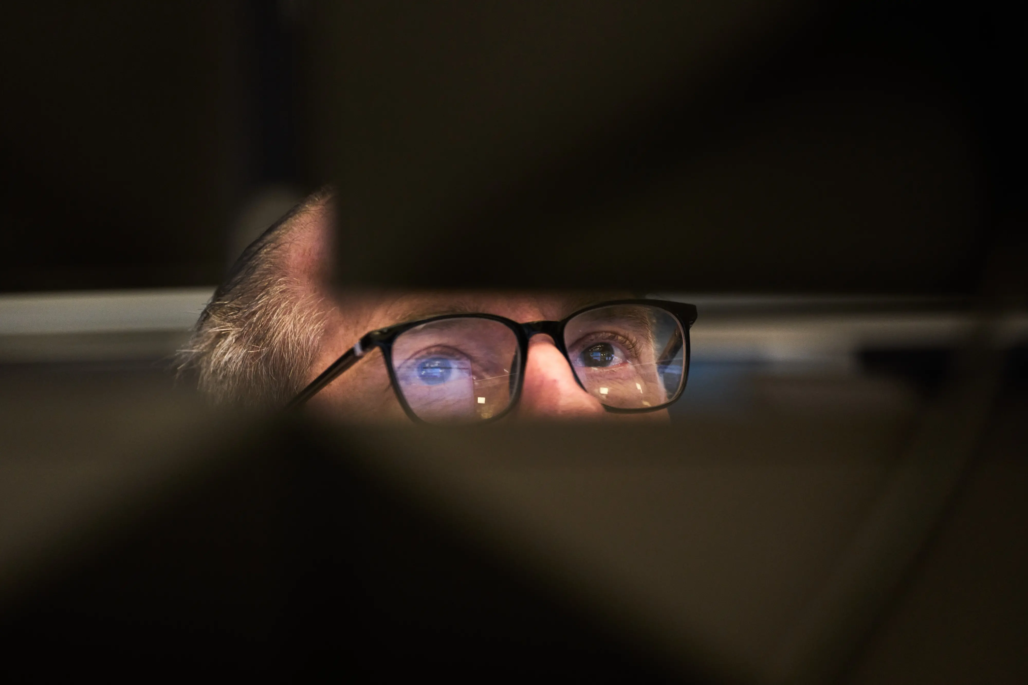 A broker watches his screens at the stock market in Frankfurt, Germany, Monday, March 9, 2026. (AP Photo/Michael Probst)