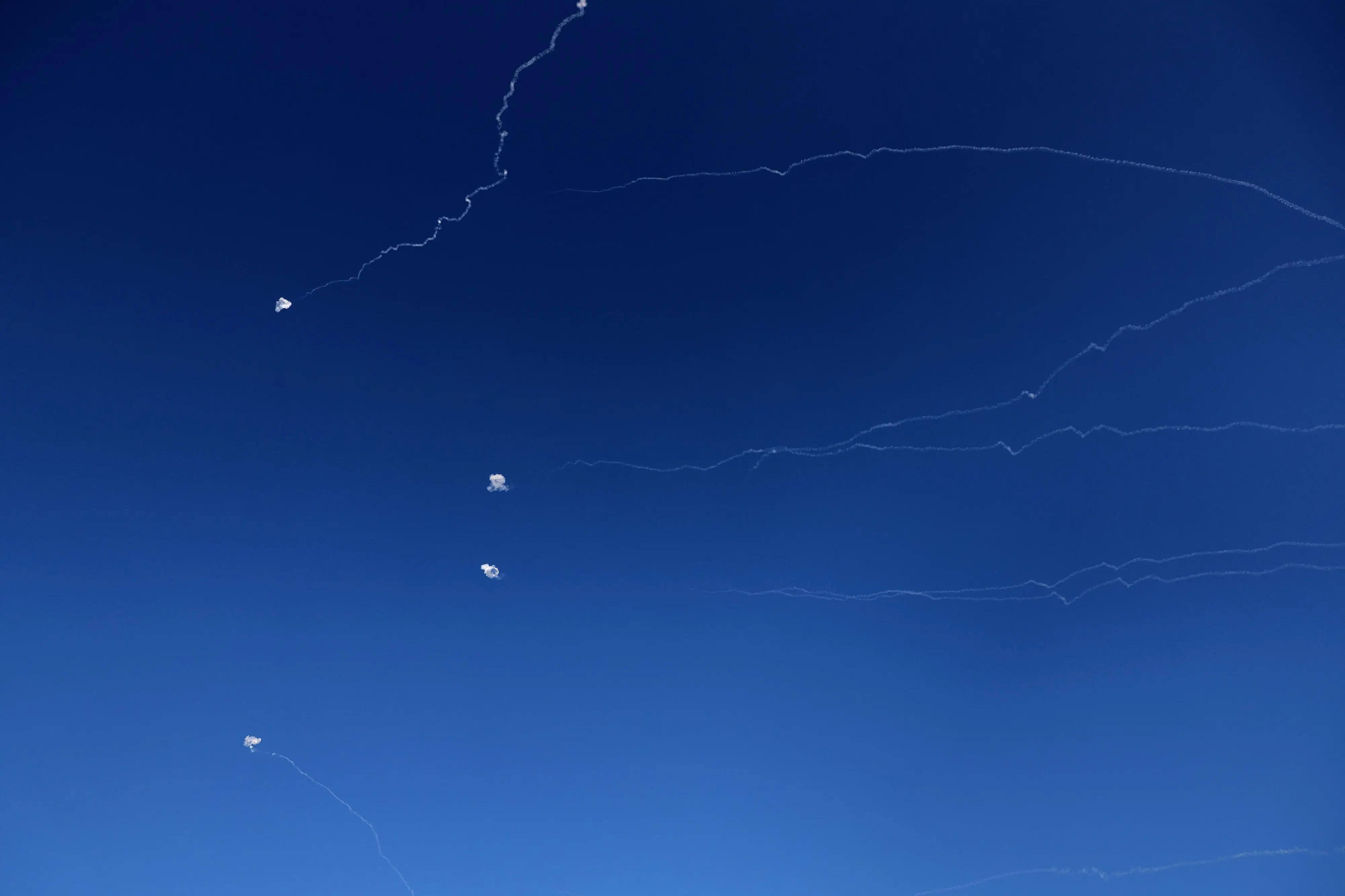 Rocket trails from an interception by Israel's Iron Dome missile defence system are pictured over Tel Aviv on March 9, 2026 | Photo: AFP