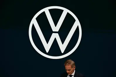 Volkswagen plans 50,000 job cuts in Germany as profits drop