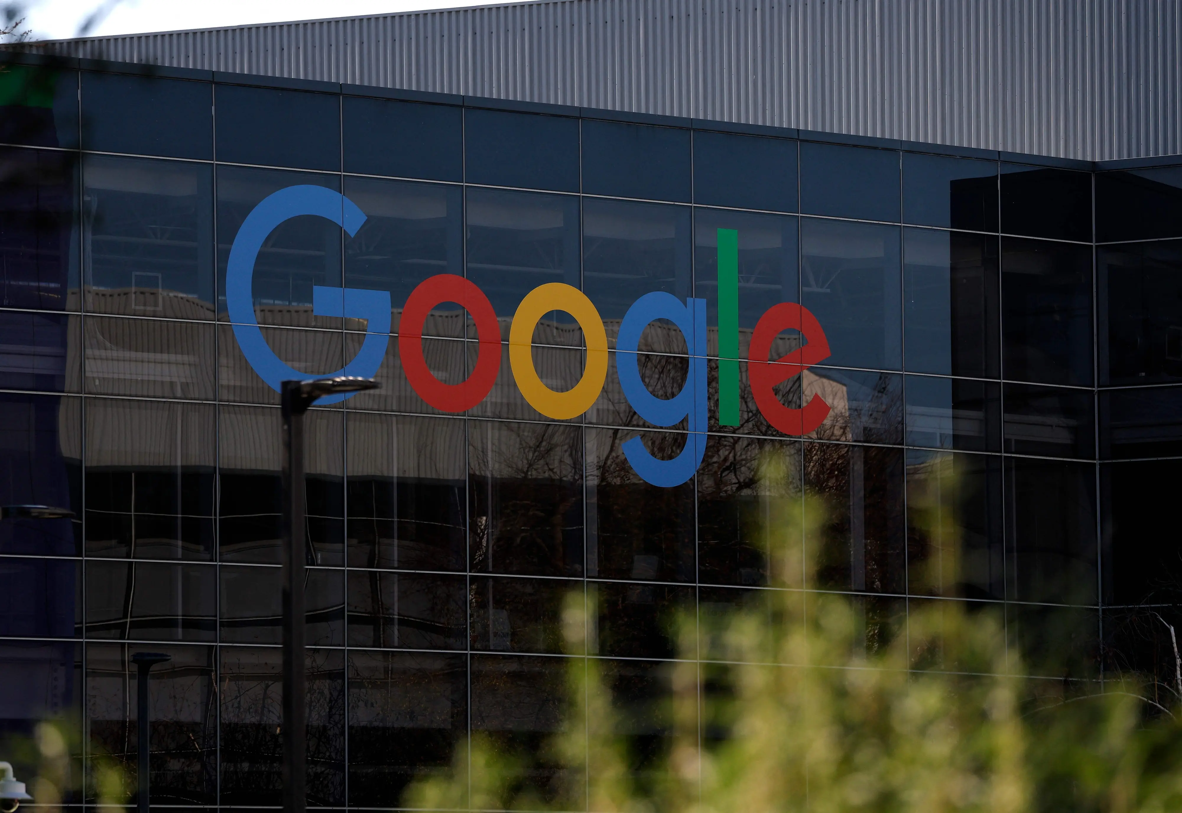 The Google logo is displayed on a building at Google headquarters in Mountain View, California | File photo: AFP