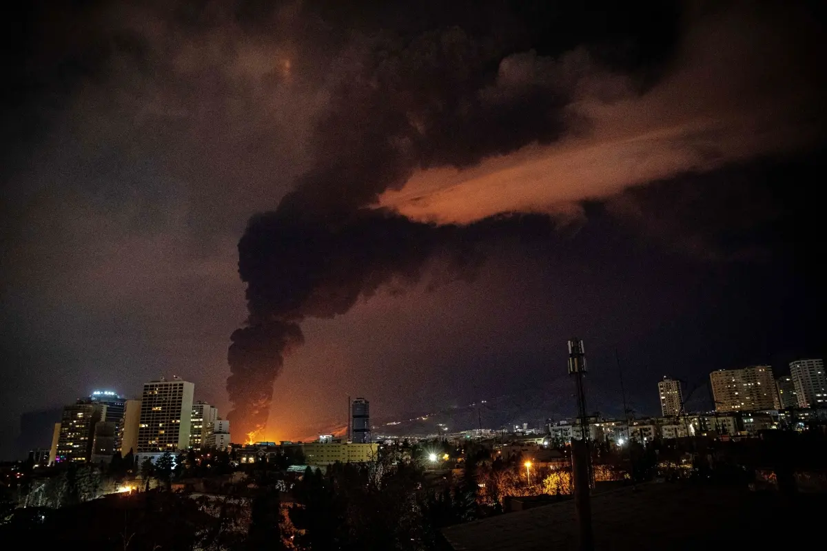 Flames and smoke rise from an oil storage facility struck as attacks hit the city during the U.S.–Israeli military campaign in Tehran, Iran | Photo: AP